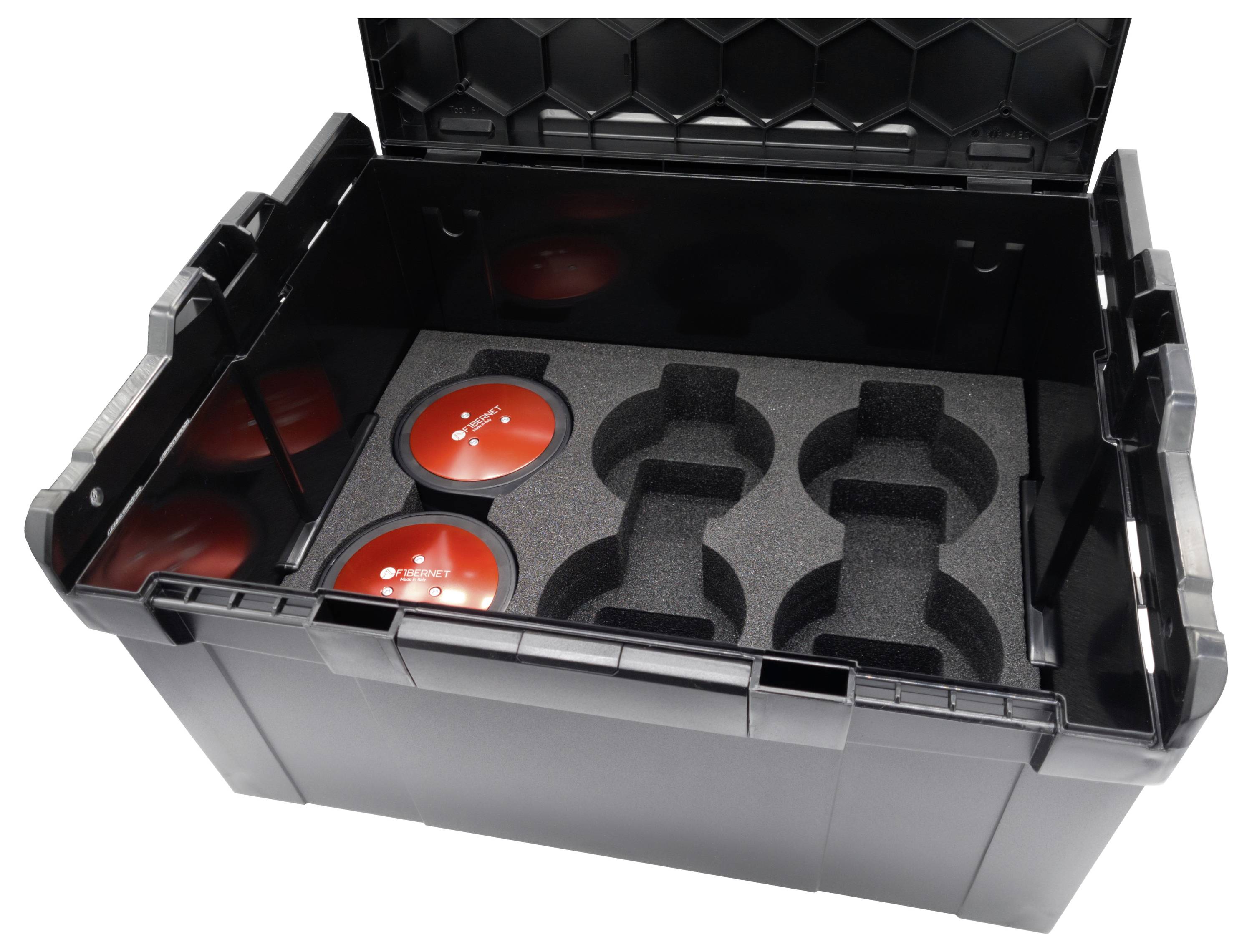 Conteneur en plastique noir avec couvercle ouvert, intérieur rembourré de mousse avec trois objets ronds rouges et de l'espace pour d'autres.