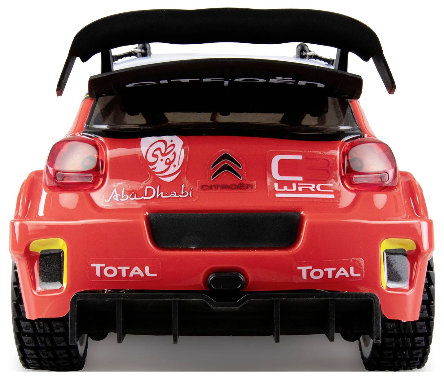 Voiture de jouet rouge vue de l'arrière, avec des autocollants de rallye et un grand aileron, sur un fond blanc.