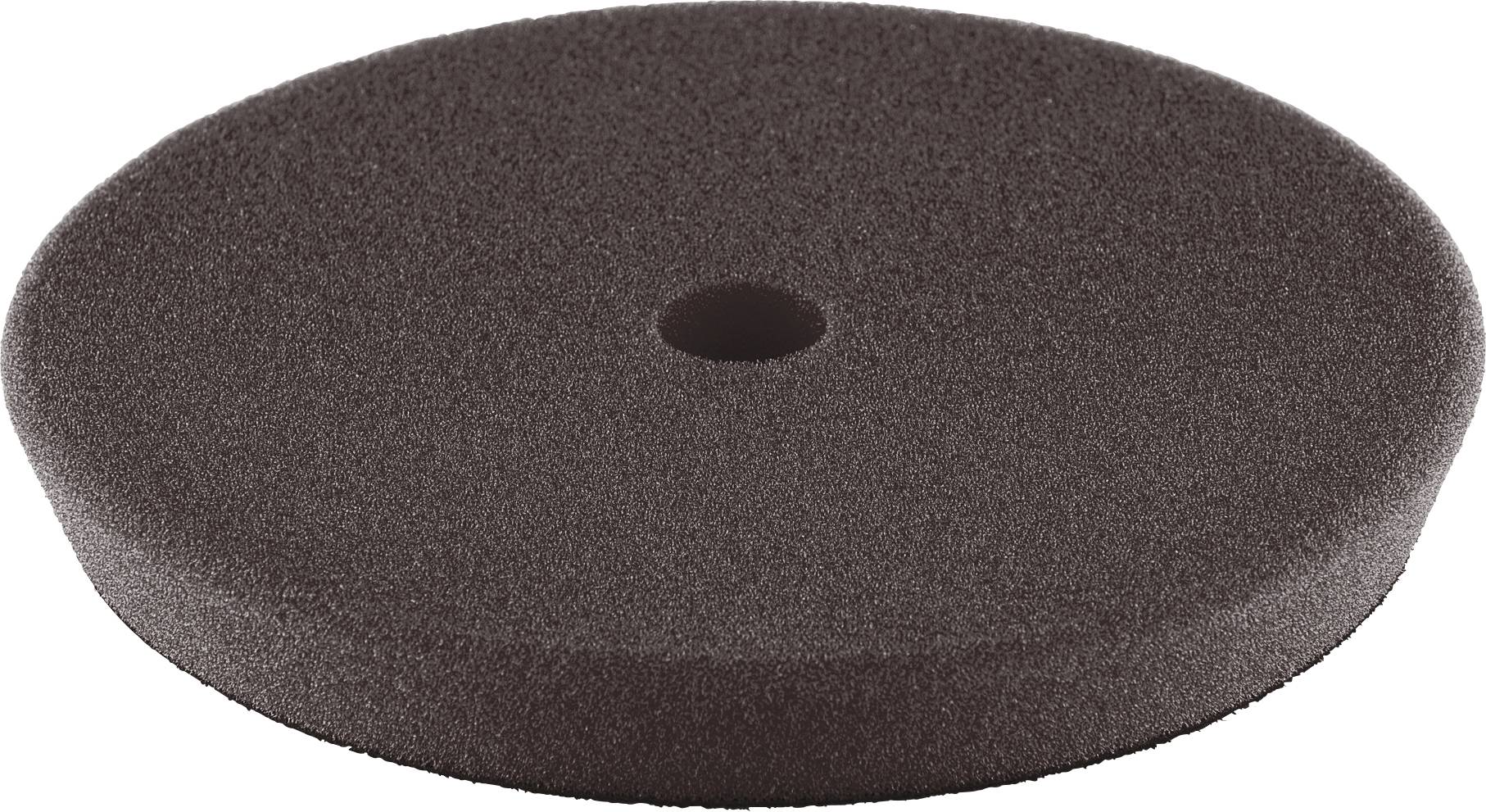 Un disque de mousse rond, gris foncé, avec un petit trou au centre.