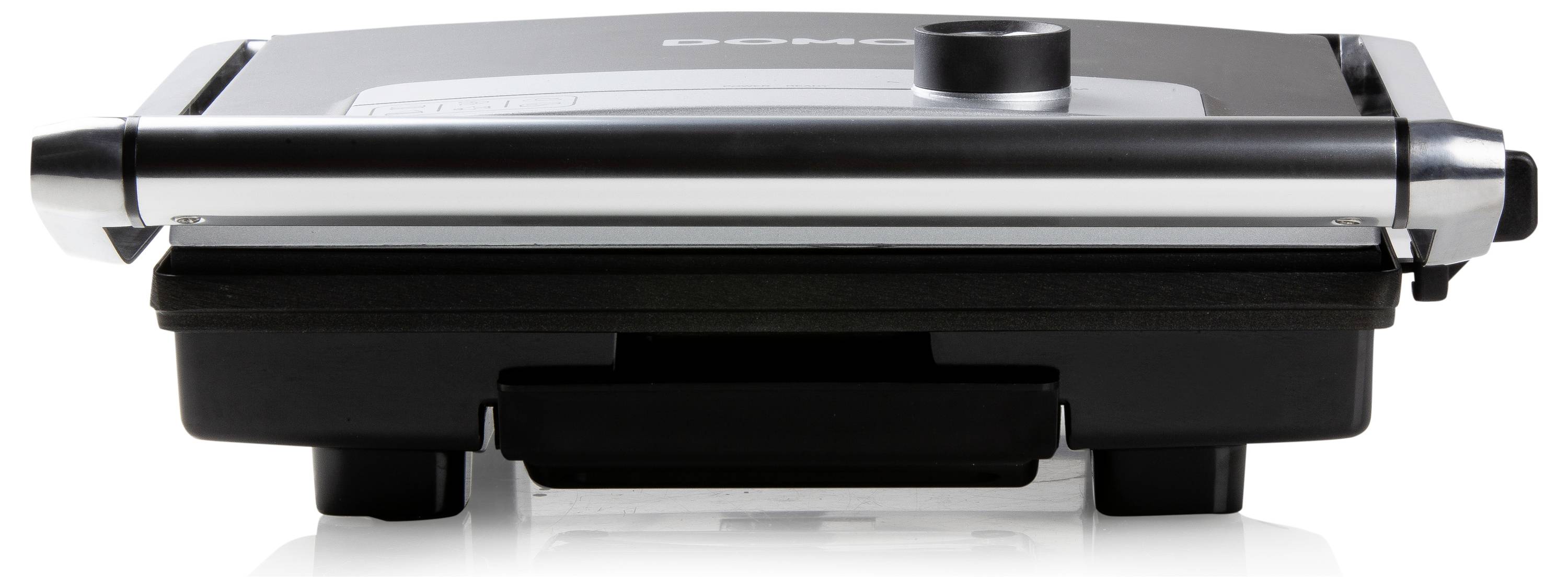 Un grill de contact avec couvercle fermé, adapté pour griller des sandwichs ou de la viande. Surface métallique, base noire.