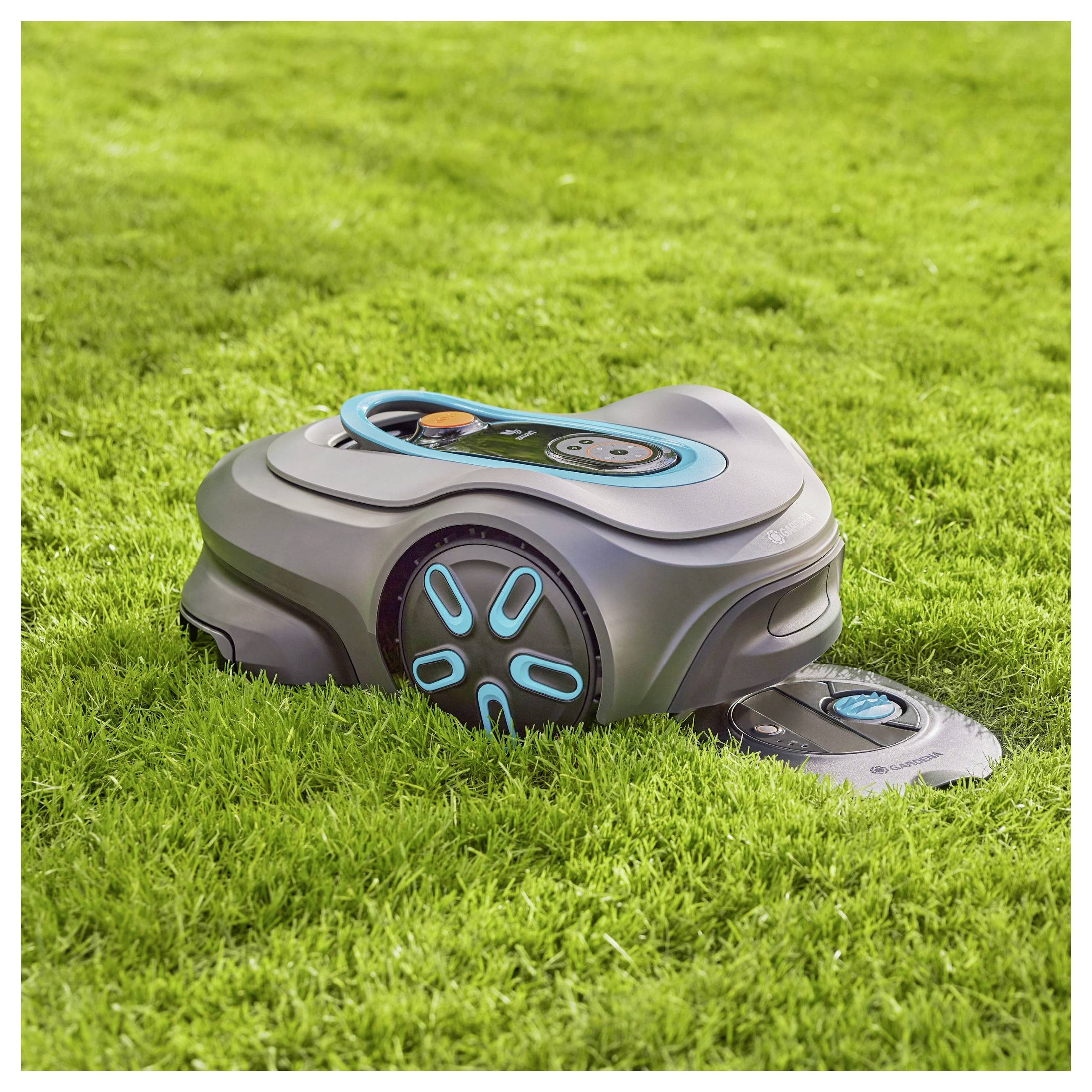 A robotic lawn mower on a well-manicured green lawn, demonstrating its function in fully automatic grass cutting.