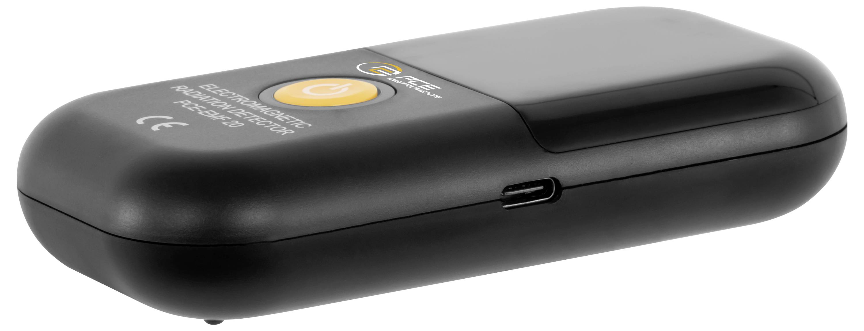 Appareil électronique portable noir avec un grand bouton d'alimentation orange et un port USB-C sur le côté, montré en profil sur un fond blanc.