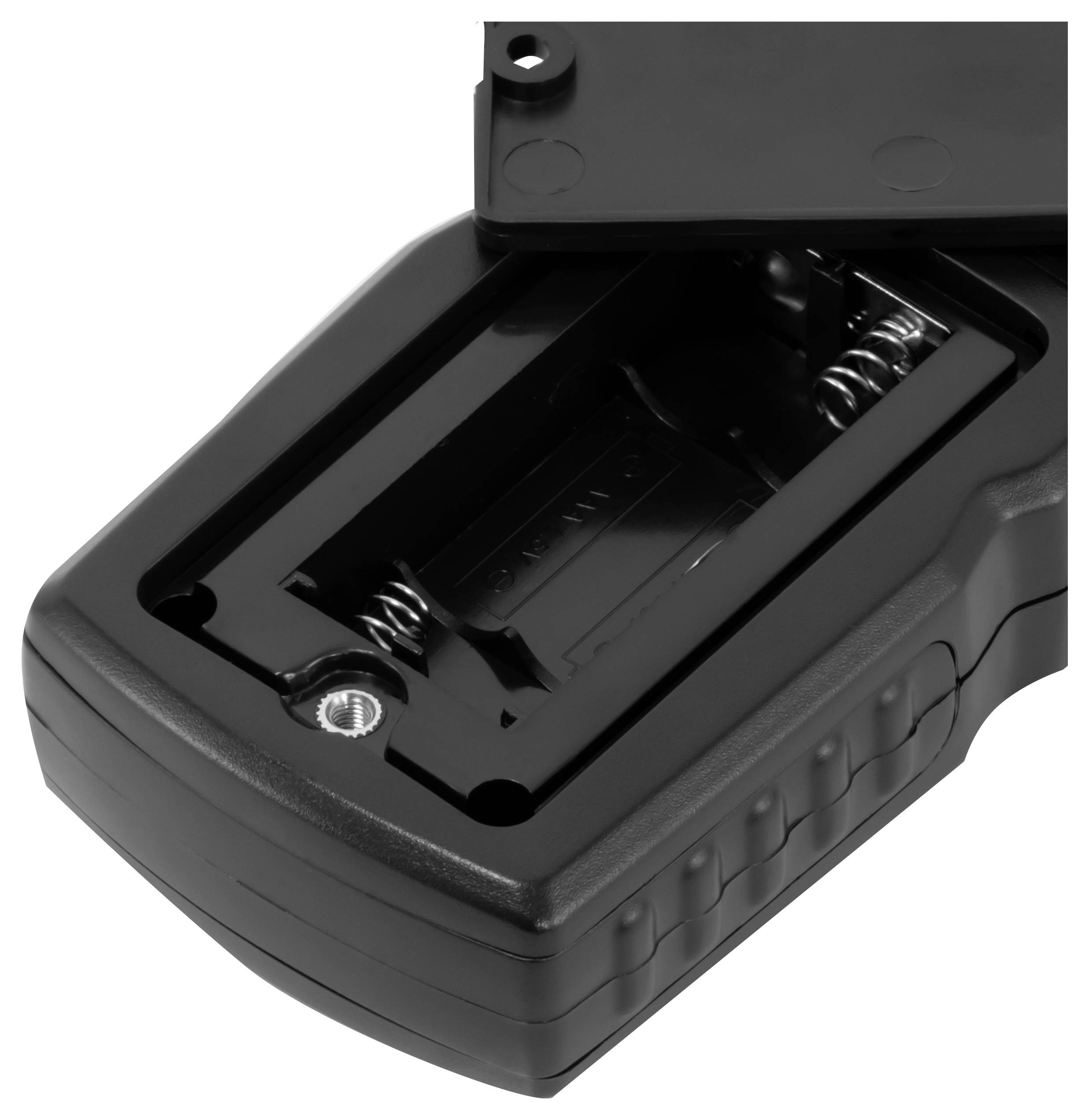 Compartiment de batterie ouvert d'un appareil électronique noir avec des contacts à ressort visibles et le couvercle ouvert à charnière.