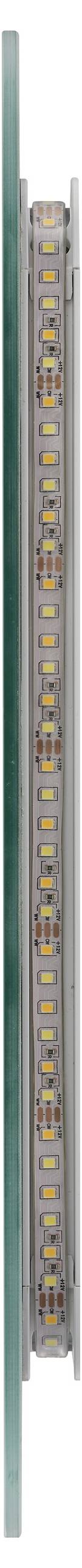 Gros plan d'un tube de verre avec des marquages colorés et une échelle, probablement un instrument de mesure, maintenu entre deux supports métalliques.
