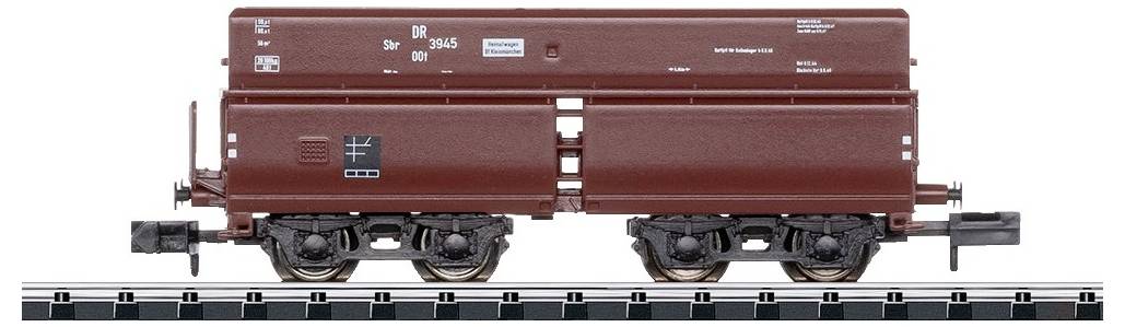 Wagon de marchandises brun sur une voie ferrée. Détails tels que inscriptions et numéros visibles. Modèle de la Deutsche Reichsbahn pour train miniature.