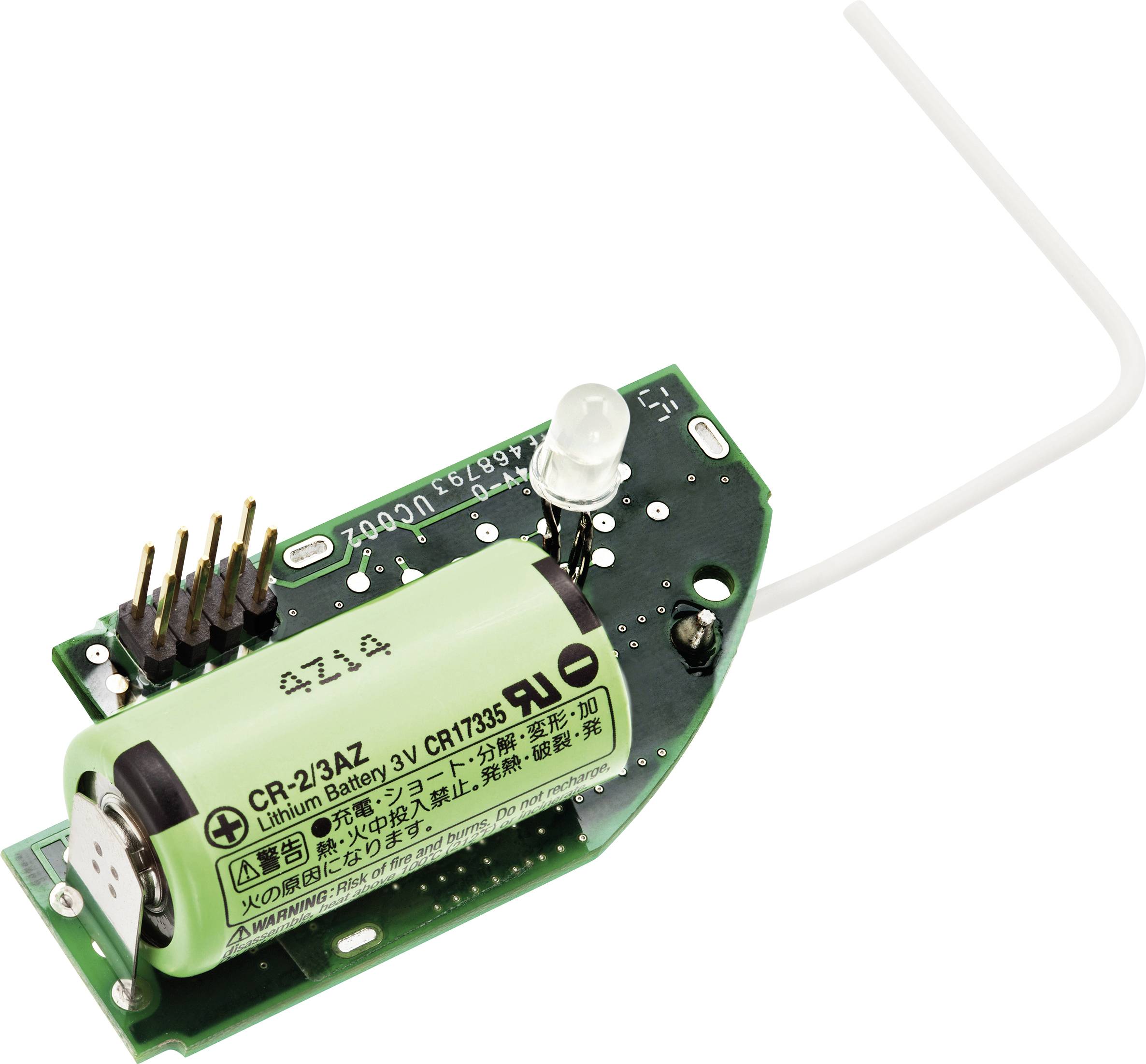 Circuit électronique avec une batterie au lithium verte et une antenne blanche. Les composants et les numéros de série sont visibles.