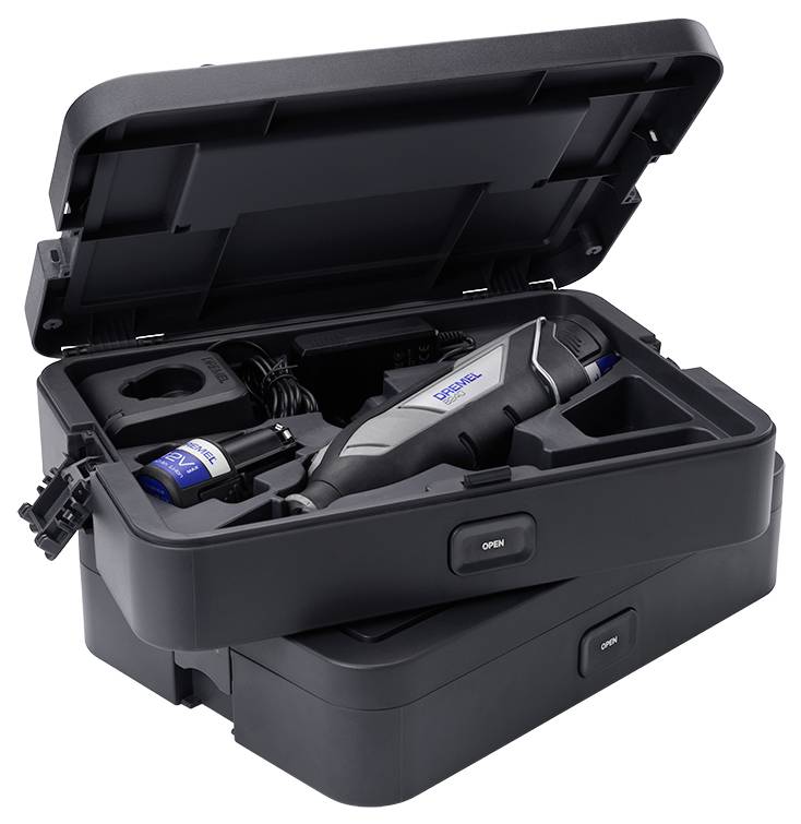 Outil multifonction électrique dans un coffret noir ouvert avec accessoires. Idéal pour les travaux de bricolage et les réparations.