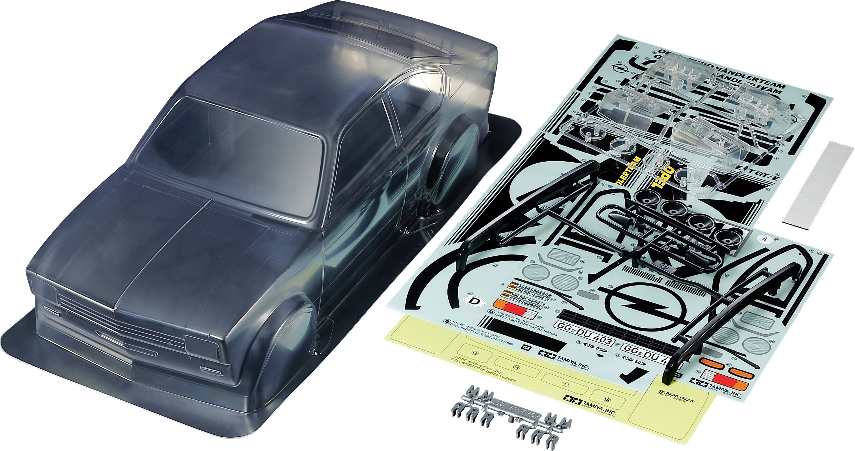 Kit de carrosserie RC avec carrosserie transparente, autocollants et petites pièces, prêt à être assemblé.