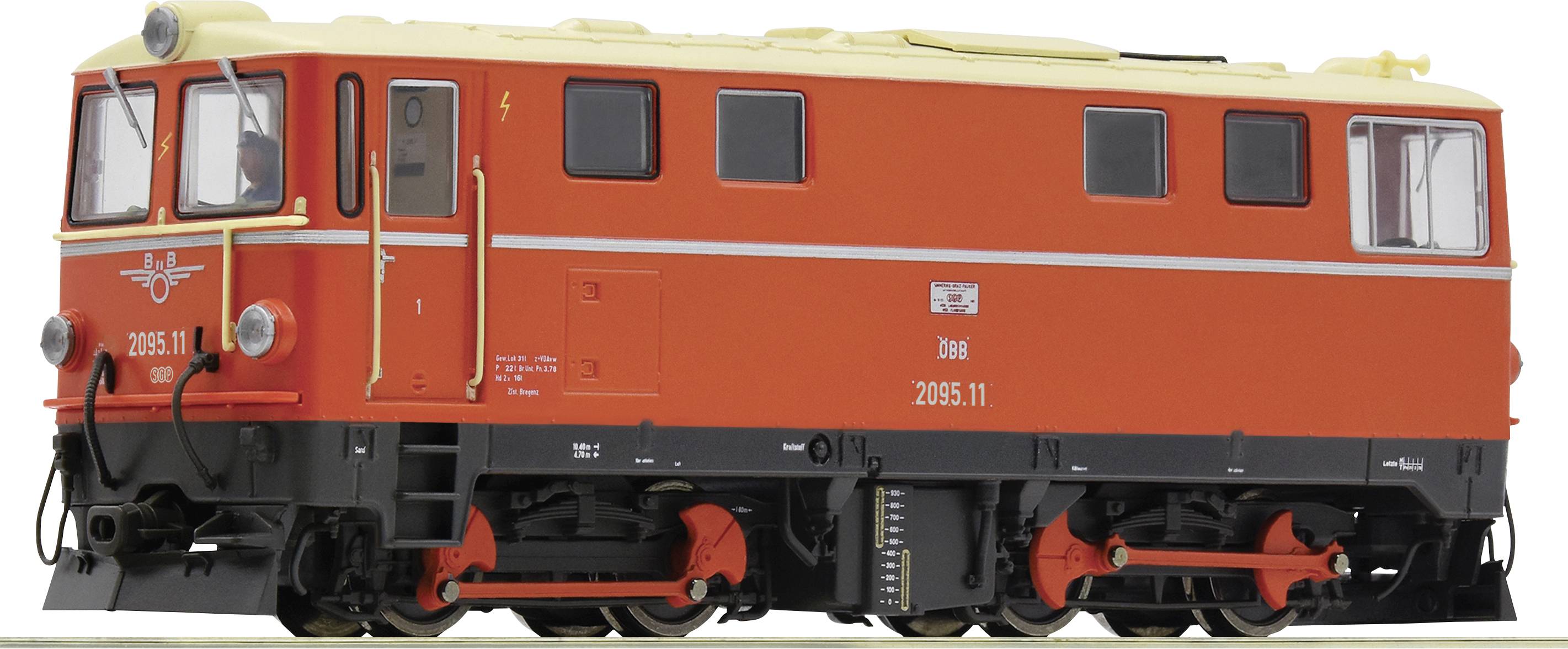 Une locomotive historique rouge, numérotée '2095.11', vue de profil, montrant des détails tels que des portes, des fenêtres et le châssis.