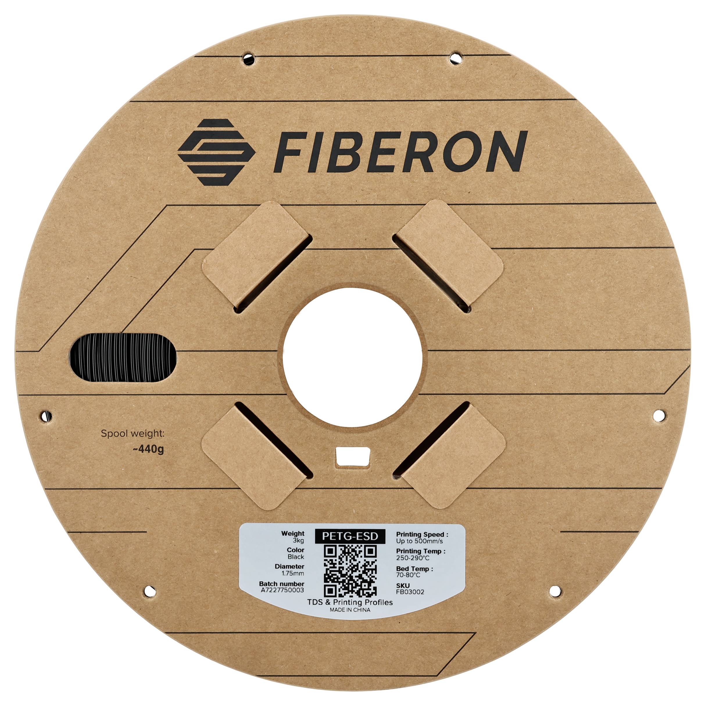 Bobine de filament ronde avec l'inscription 'FIBERON'. L'étiquette indique des informations sur le poids, le matériau PETG-ESD et la vitesse d'impression. Code QR présent.