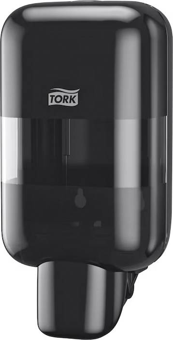 Un distributeur de savon noir de Tork, monté sur un mur, utilisé pour la distribution hygiénique de savon liquide dans les toilettes publiques.