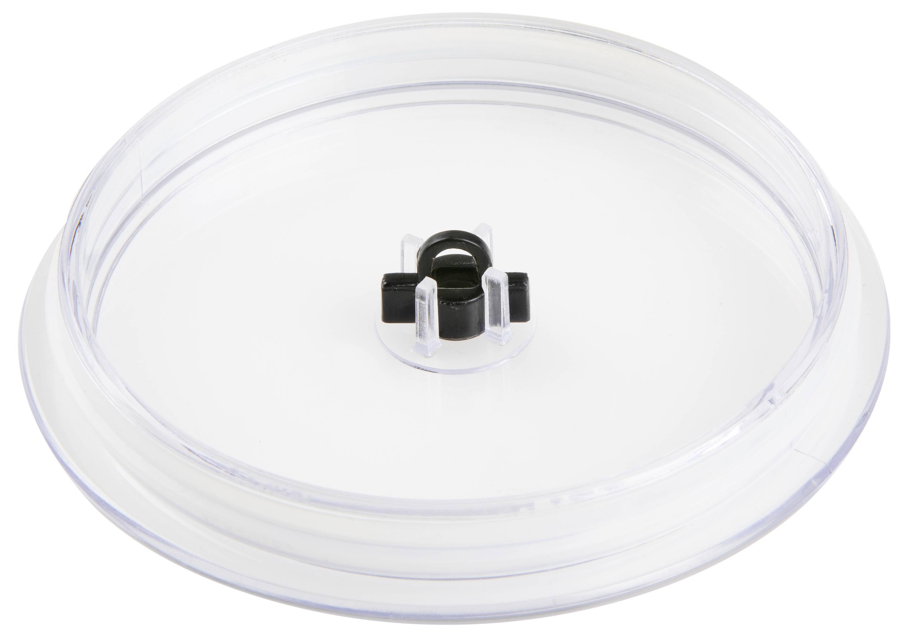 Couvercle en plastique transparent et rond, avec un fermoir en plastique noir au centre, posé sur une surface blanche.