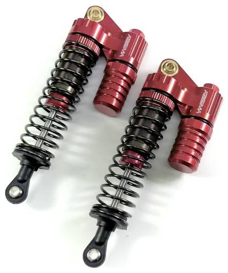 Deux amortisseurs rouges avec ressorts hélicoïdaux, disposés symétriquement, sur une surface claire. Adaptés pour les véhicules radiocommandés.