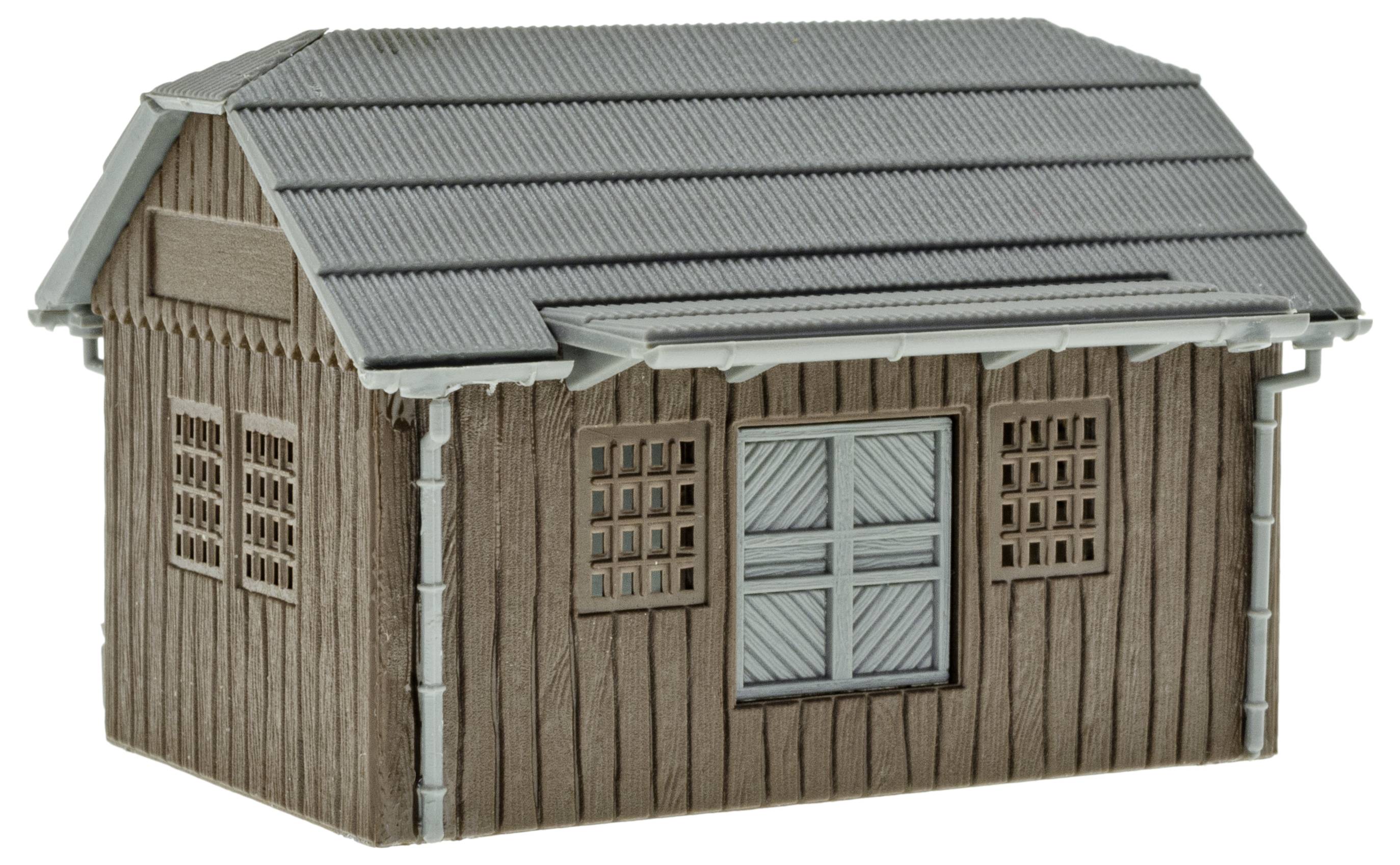 Modèle gris, petit abri en bois avec un toit incliné et des fenêtres sur les côtés. Adapté pour les dioramas de modélisme.