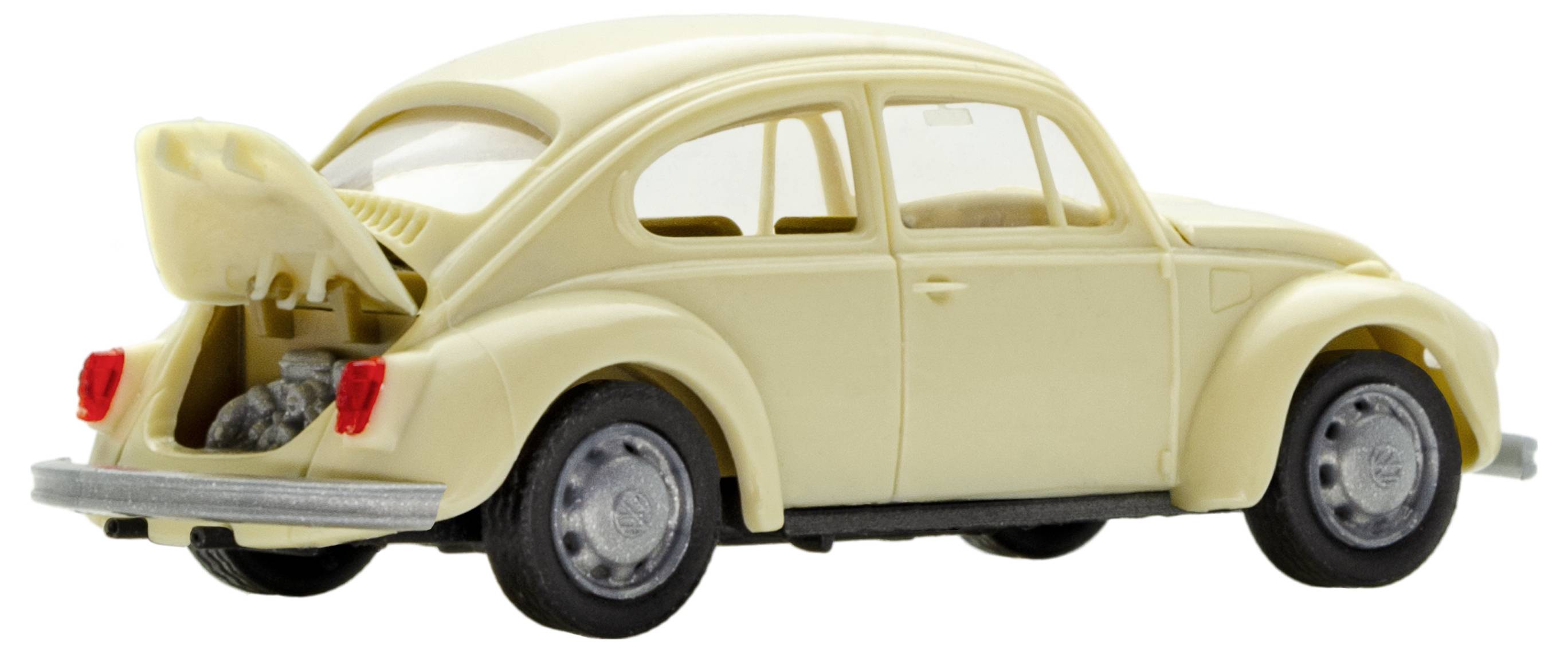 Une coccinelle de modèle réduit de couleur crème avec le coffre ouvert. Le coffre arrière révèle un petit espace de rangement.
