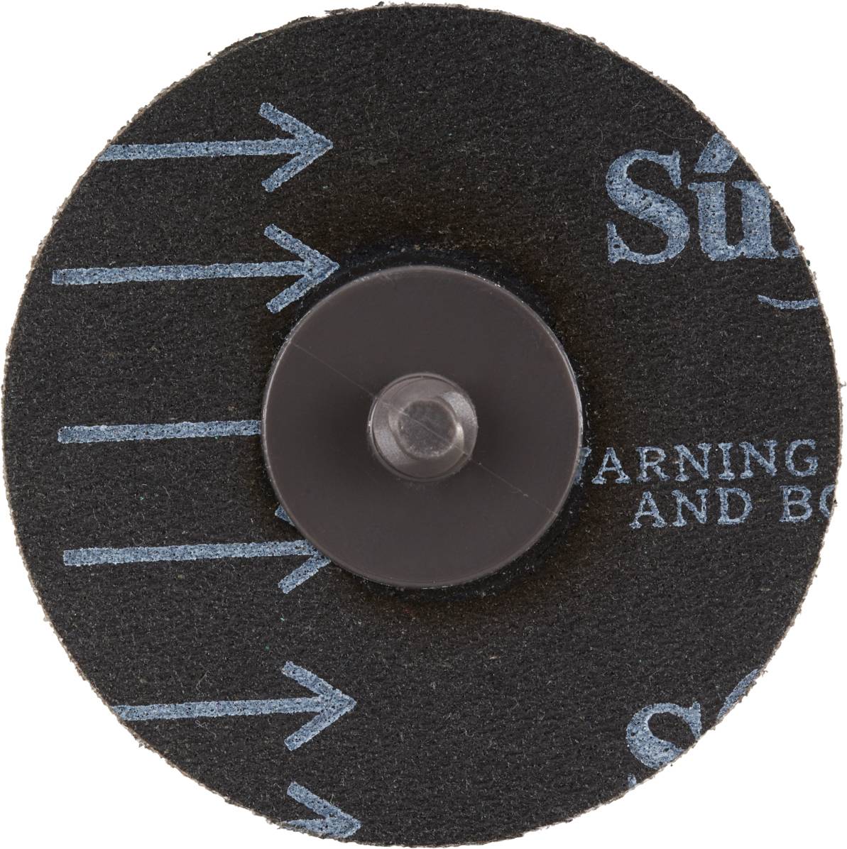 Disque abrasif avec des flèches bleues indiquant le sens de rotation. Élément de fixation centrale visible.