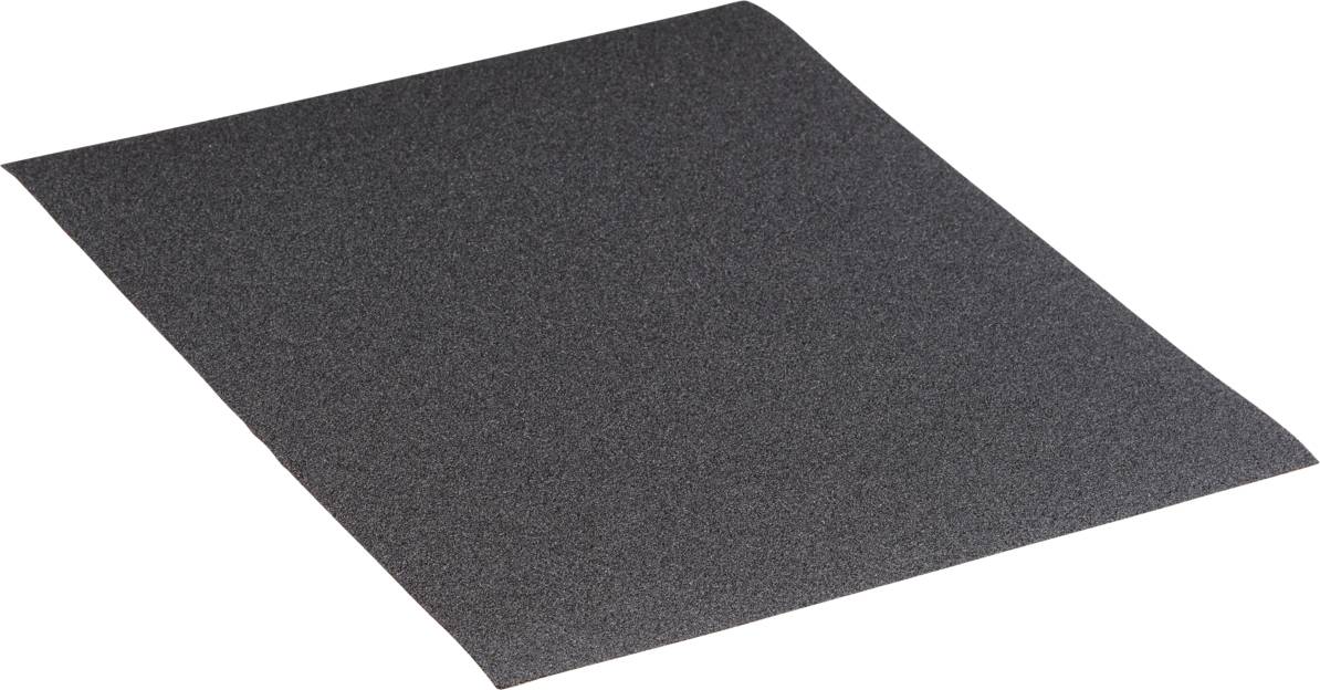 Une feuille de papier de verre noir est posée à plat sur une surface, légèrement inclinée.