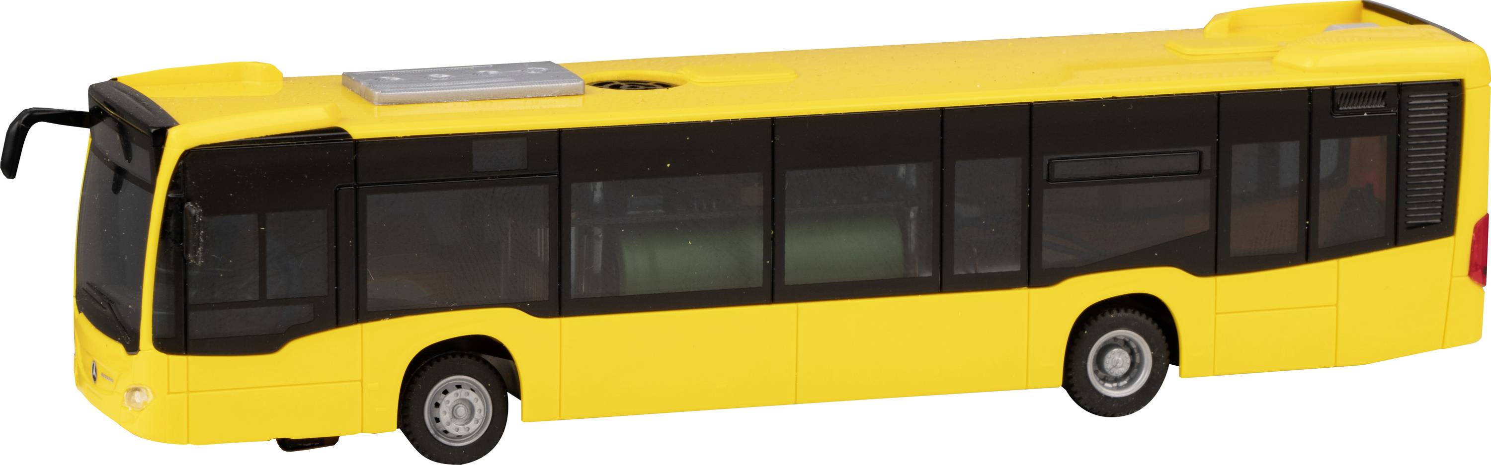 Bus jouet jaune en plastique avec des fenêtres et des roues noires, vue de côté droit.