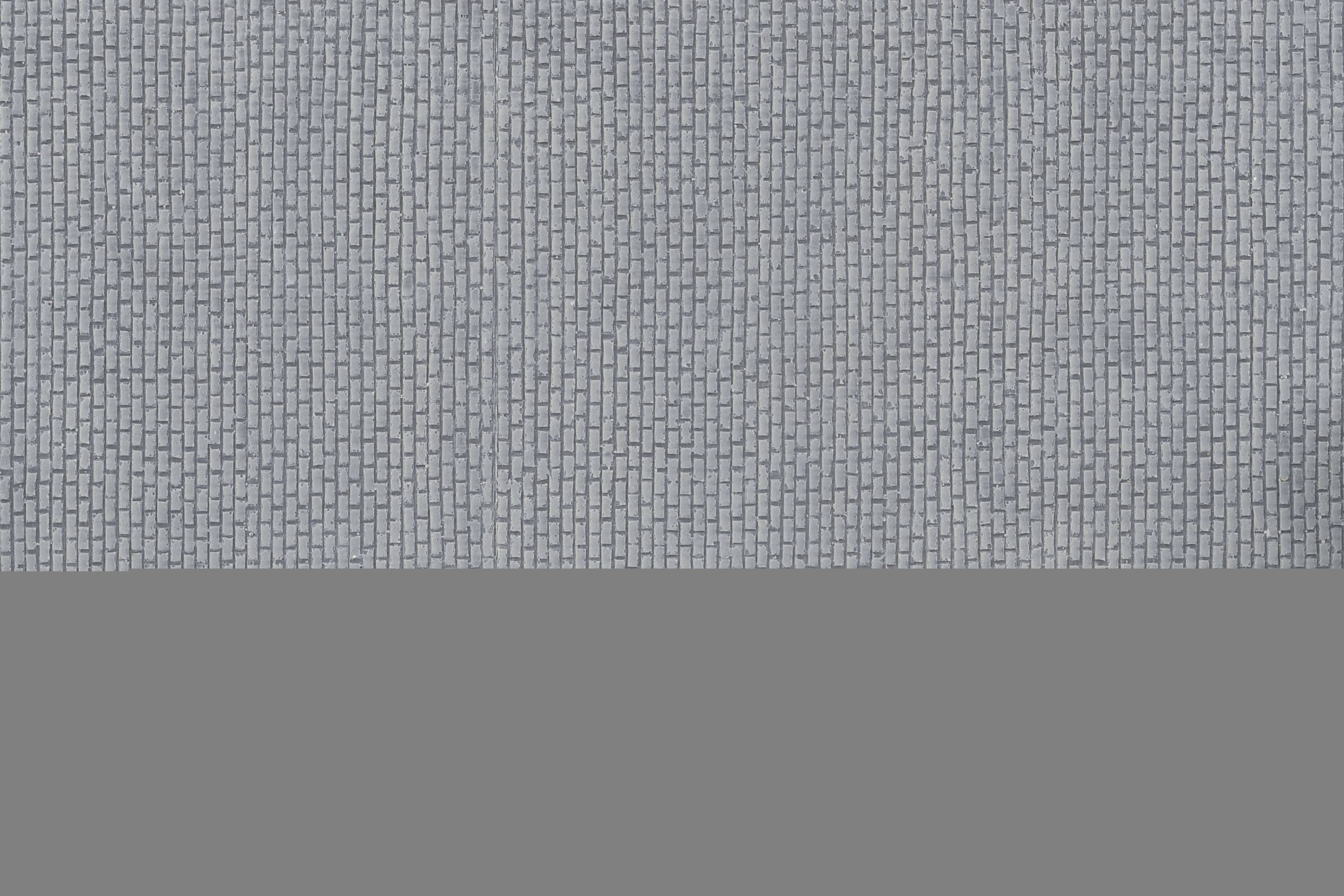 Mur bleu avec un petit motif de briques et un sol gris.