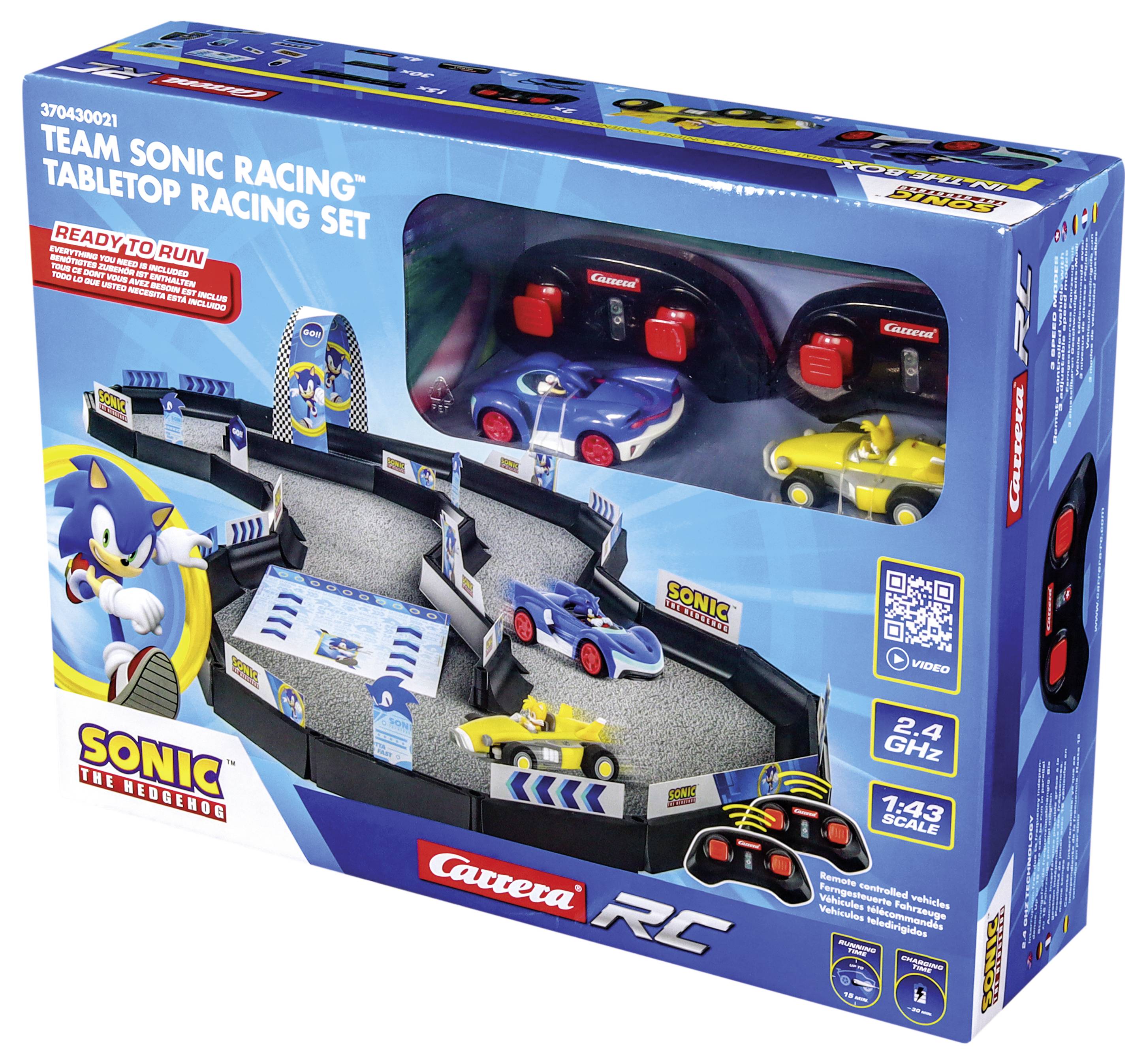 Jeu de course de table télécommandé 'Team Sonic Racing' dans son carton. Comprend un circuit de course, trois voitures de course et accessoires. Marque Carrera RC.