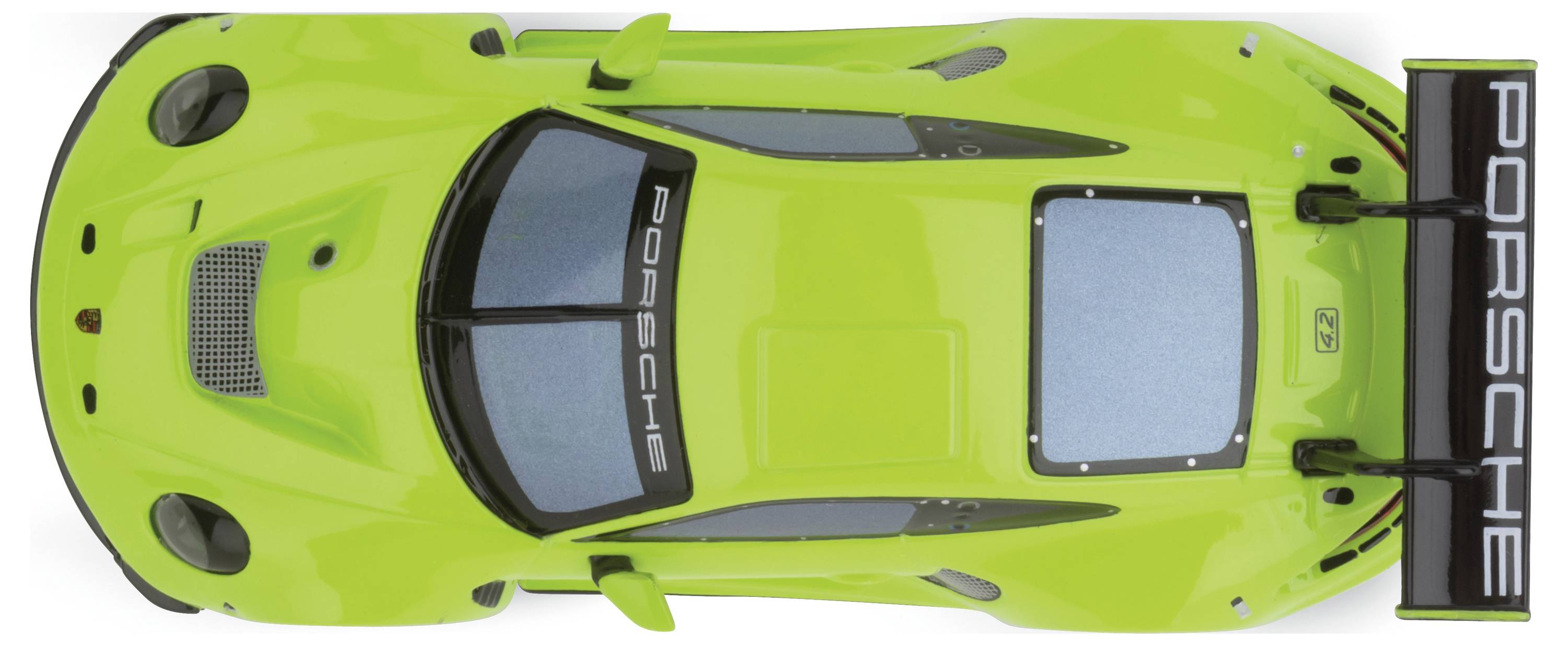 Un modèle de voiture verte vu de dessus avec l'inscription « Porsche » sur le spoiler.