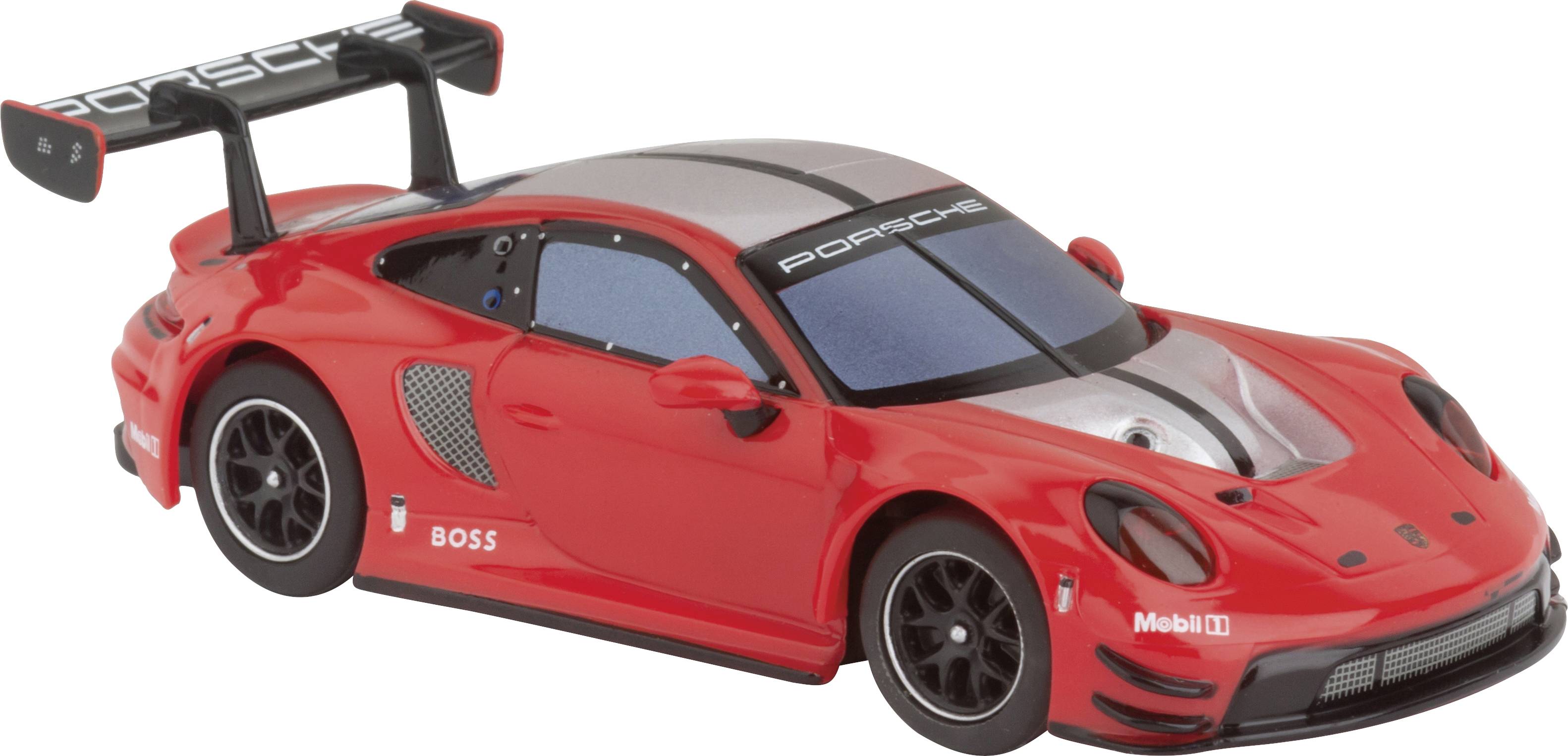 Une voiture de course miniature rouge avec le logo Porsche, un design aérodynamique et un aileron arrière.