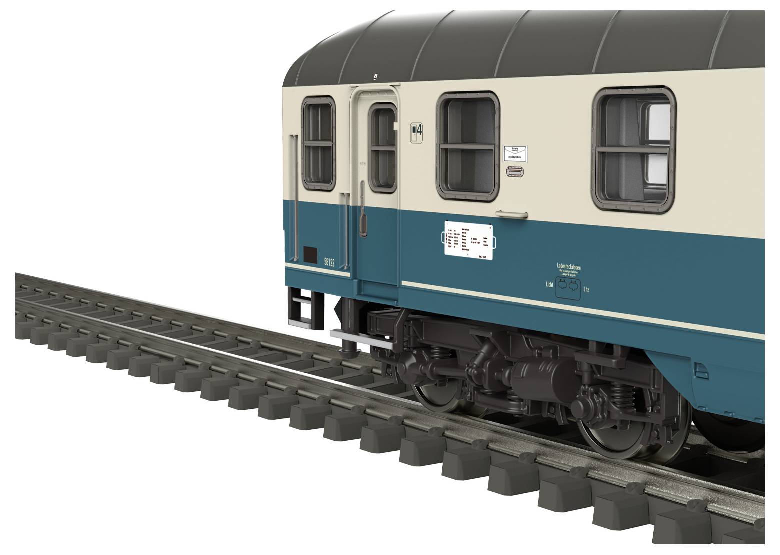 Un wagon de train miniature est posé sur une voie ferrée. Le wagon est de couleur crème et bleu turquoise, avec des détails comme des fenêtres et une inscription sur le wagon.