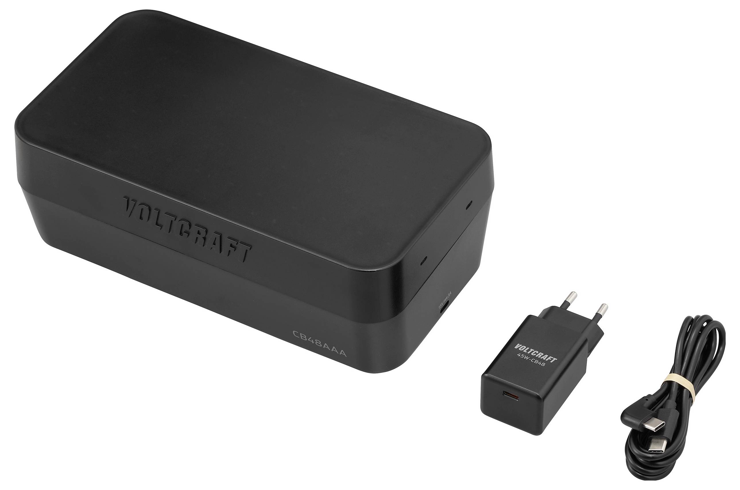 Ensemble de batterie externe 'Voltcraft' noir, comprenant une batterie externe rectangulaire, un adaptateur secteur et un câble USB.