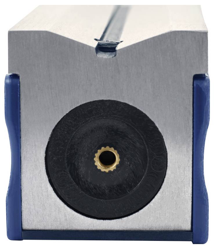 Un gros plan d'un dispositif rectangulaire en métal avec un composant circulaire noir central, présentant un petit connecteur en laiton, sur un fond neutre.