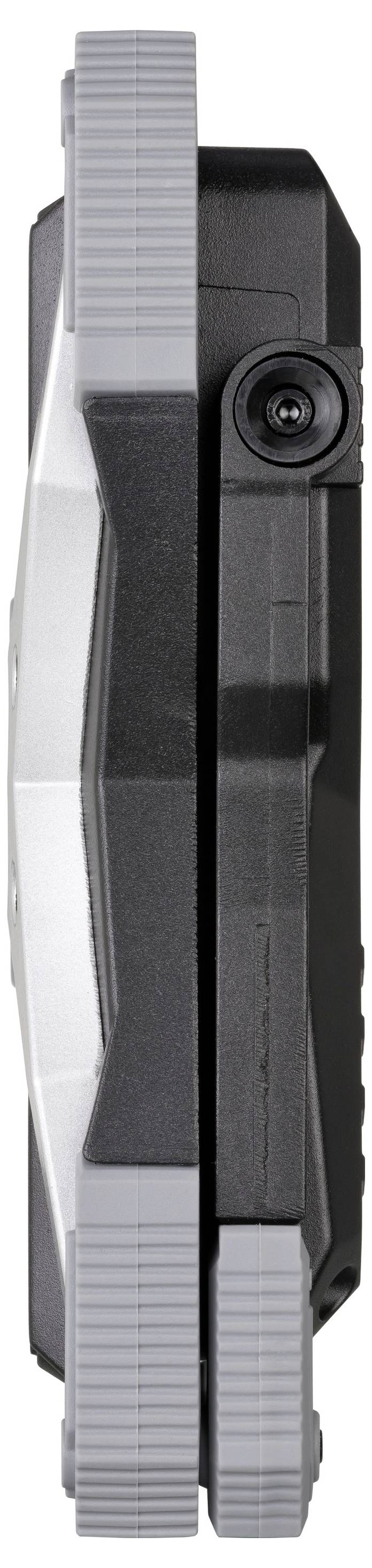 Vue latérale d'un dispositif ou module mécanique noir et gris avec un bord avant gris cannelé et un connecteur circulaire ou une lentille sur le côté.