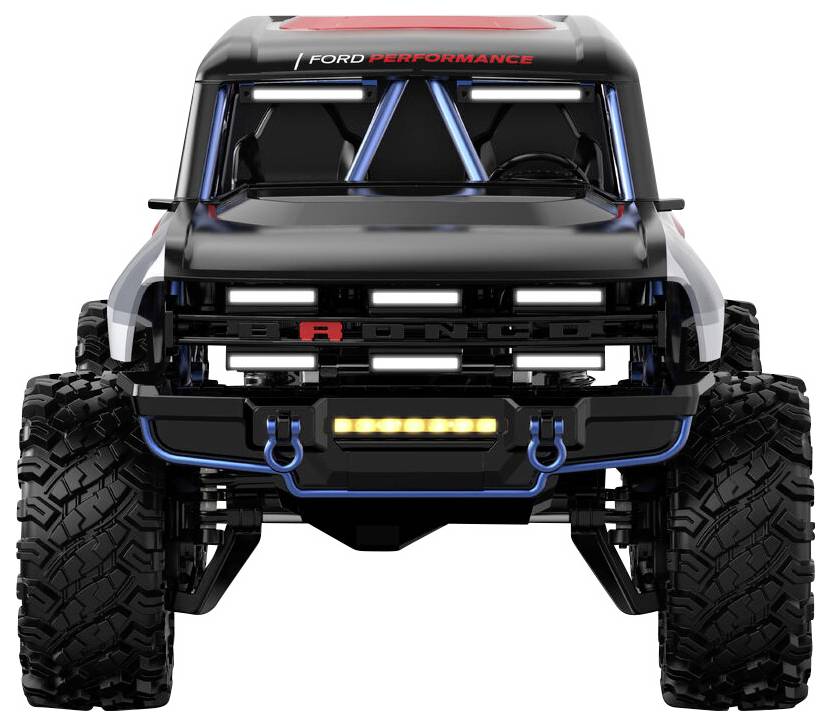 Un véhicule tout-terrain noir avec de grandes roues et l'étiquette 'Ford Performance', vu de face, soulignant un design robuste et une durabilité impressive.