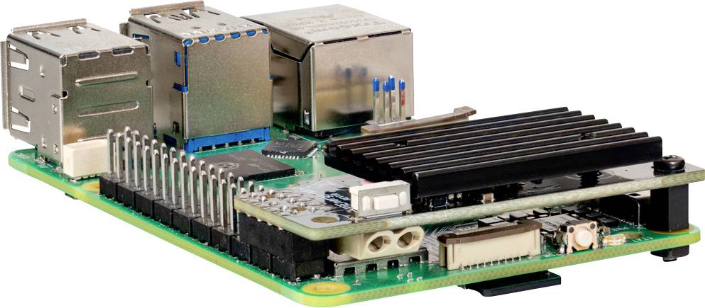 Un ordinateur monocarte doté de ports USB, d'un port ethernet et d'un dissipateur thermique sur sa surface, utilisé pour des projets informatiques et de développement.