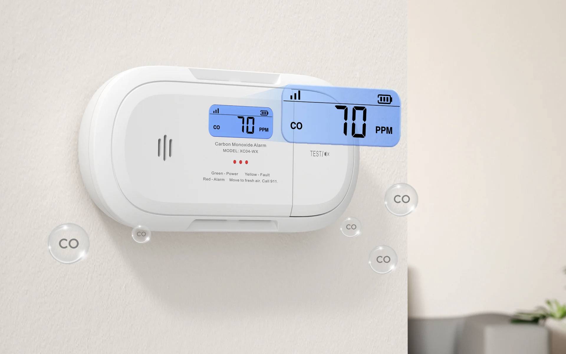 L'alarme de monoxyde de carbone affiche « 70 PPM ». L'affichage numérique met en évidence les niveaux de CO. L'appareil est monté sur un mur avec un éclairage ambiant.