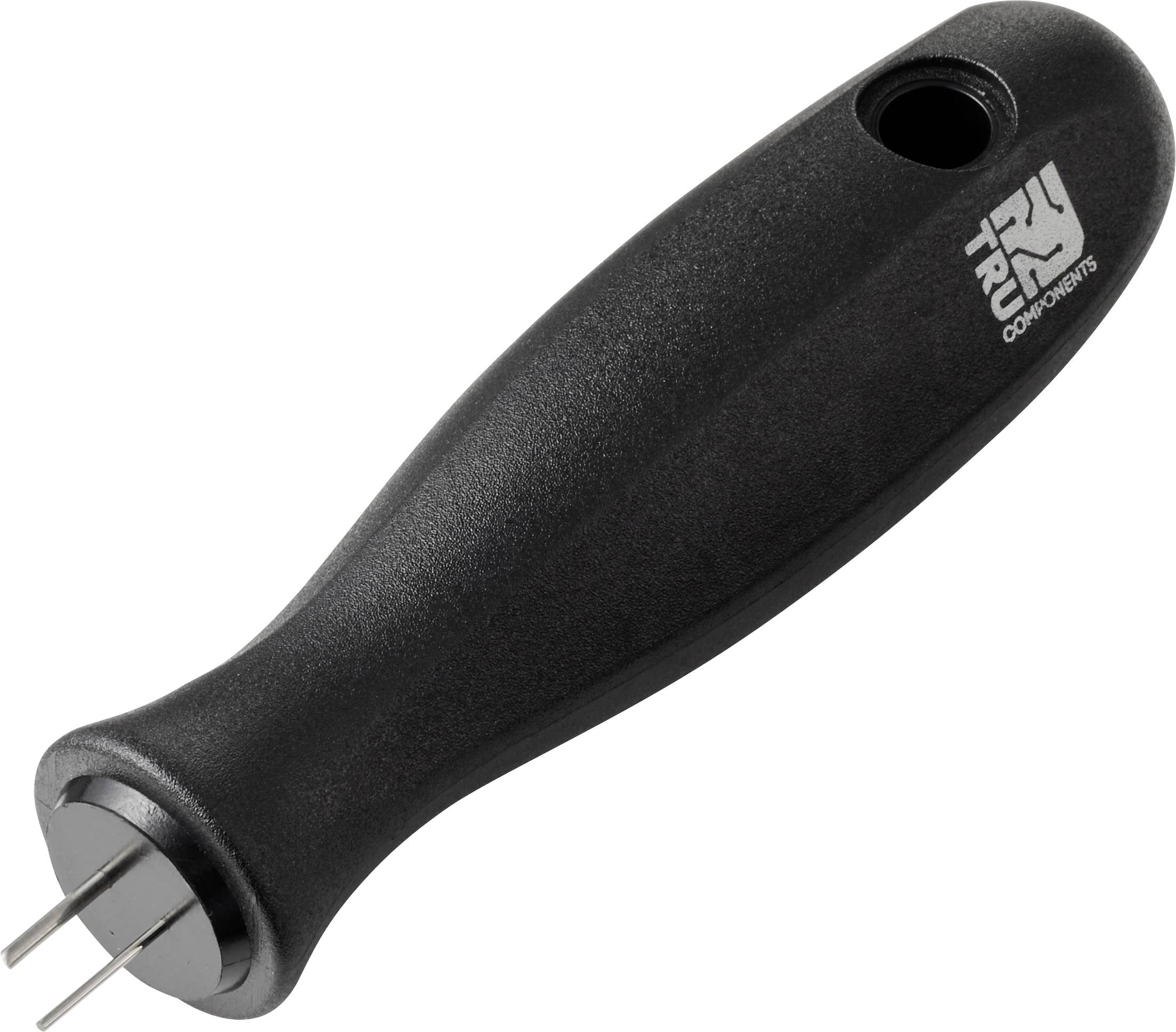 Un outil noir muni d'une poignée et de trois dents métalliques, utilisé pour retirer les valves des pneus de bicyclette.