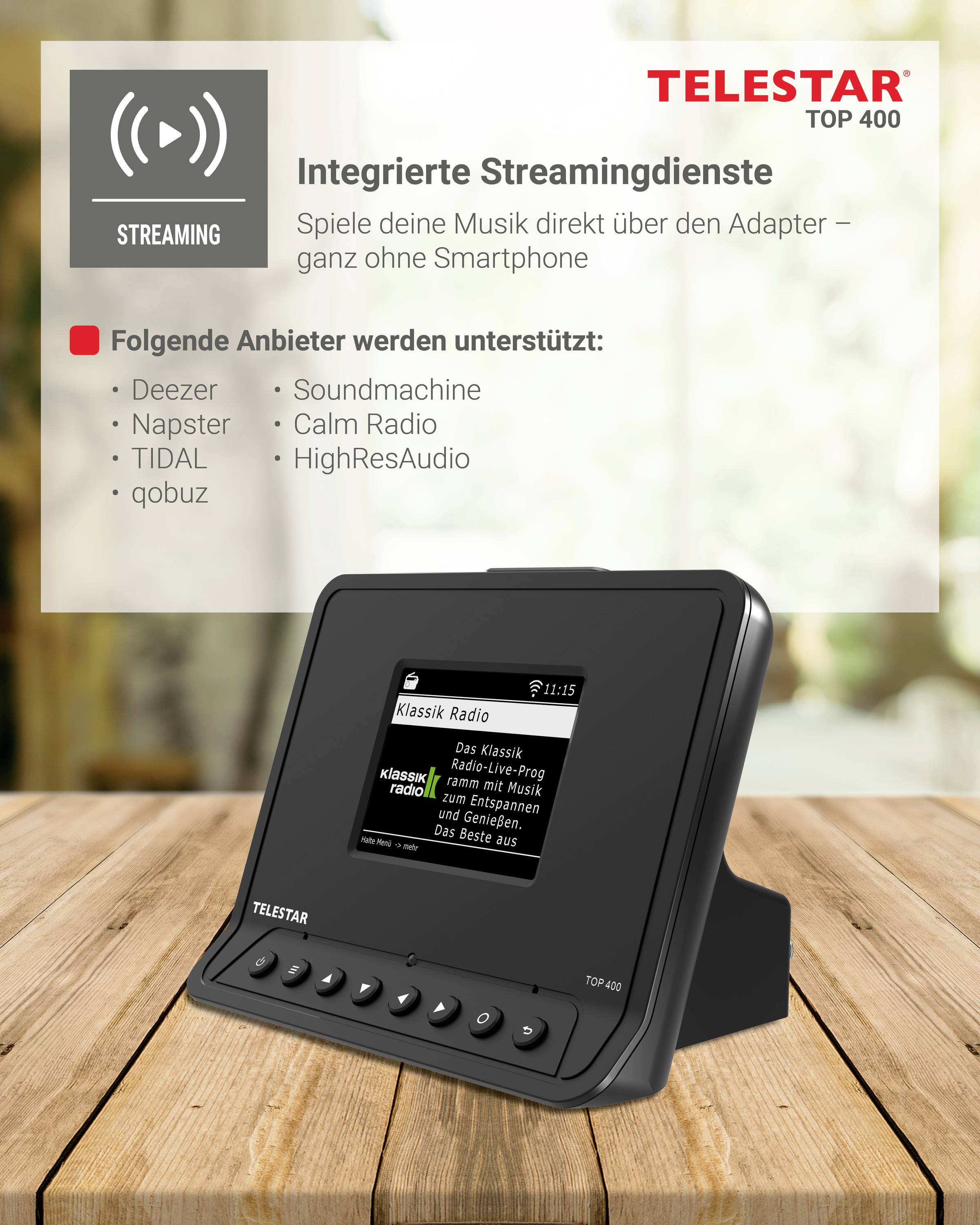 Un appareil de streaming noir sur une table en bois. Il affiche 'Klassik Radio' sur l'écran. Services pris en charge : Deezer, Napster, TIDAL, qobuz, Soundmachine, Calm Radio, HighResAudio.