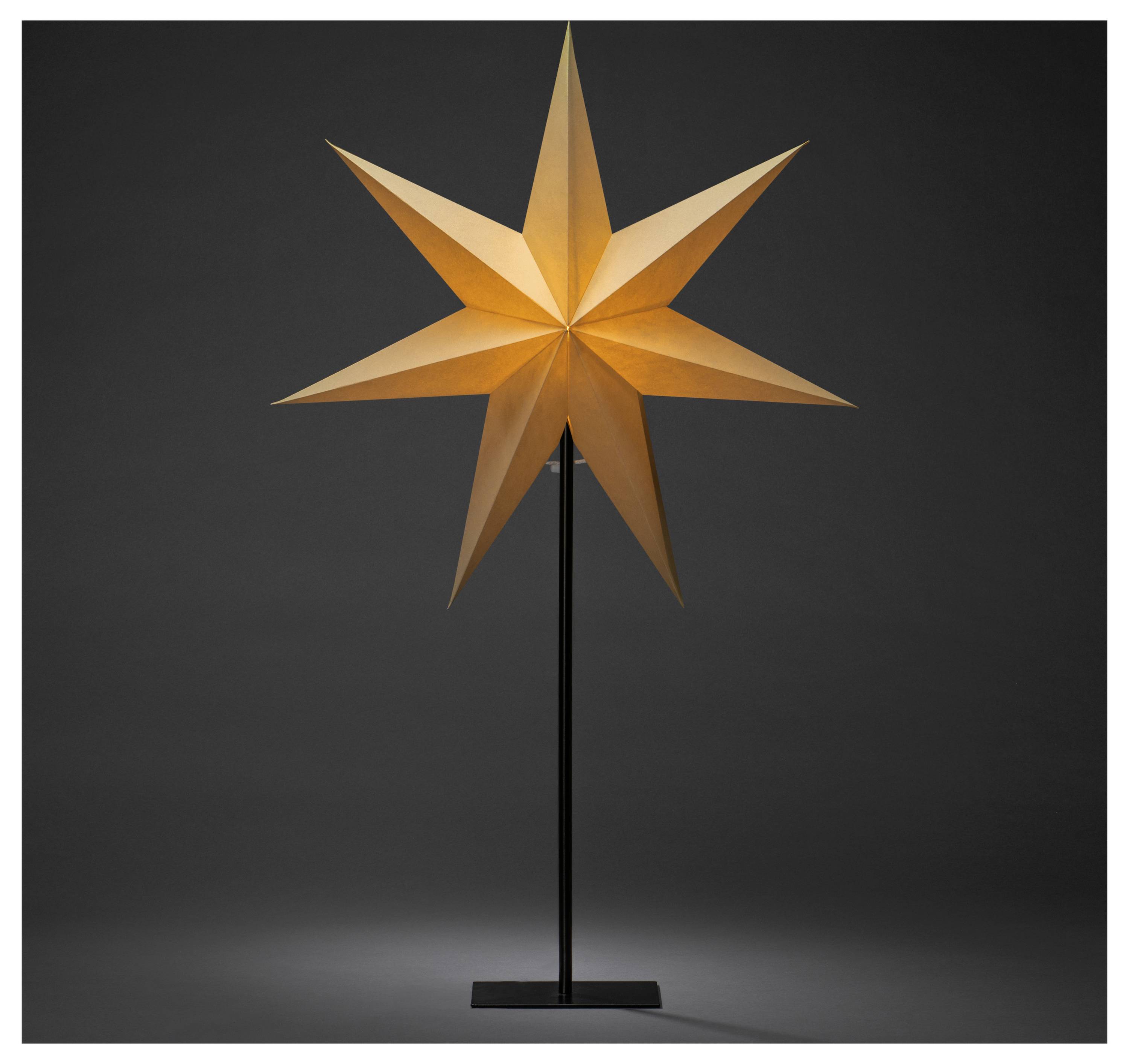 Une étoile orange brillante à huit branches est montée sur un socle noir, sur un fond sombre.