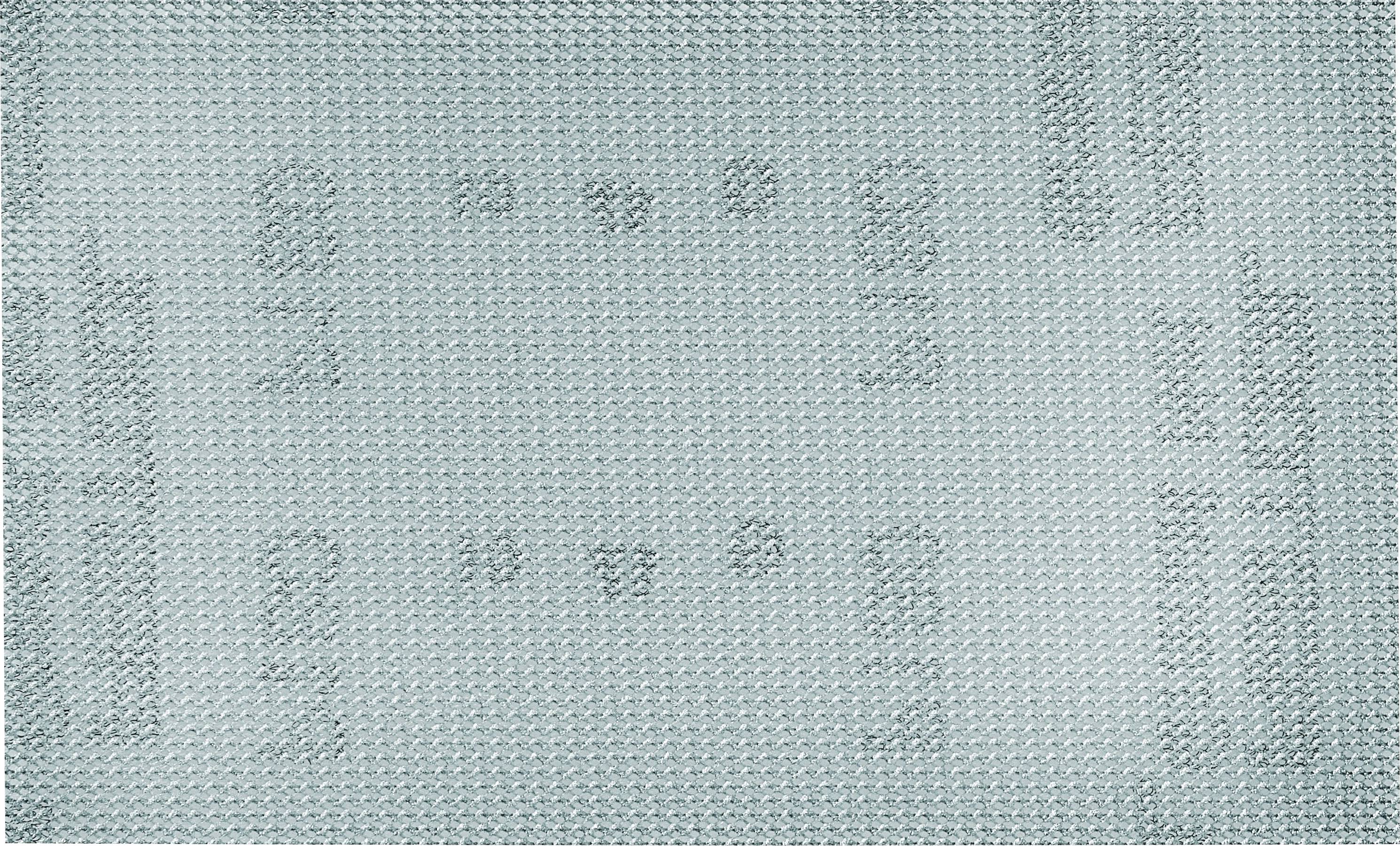 Motif tricoté bleu clair avec des formes et des designs abstraits, évoquant un textile douillet et décoratif.