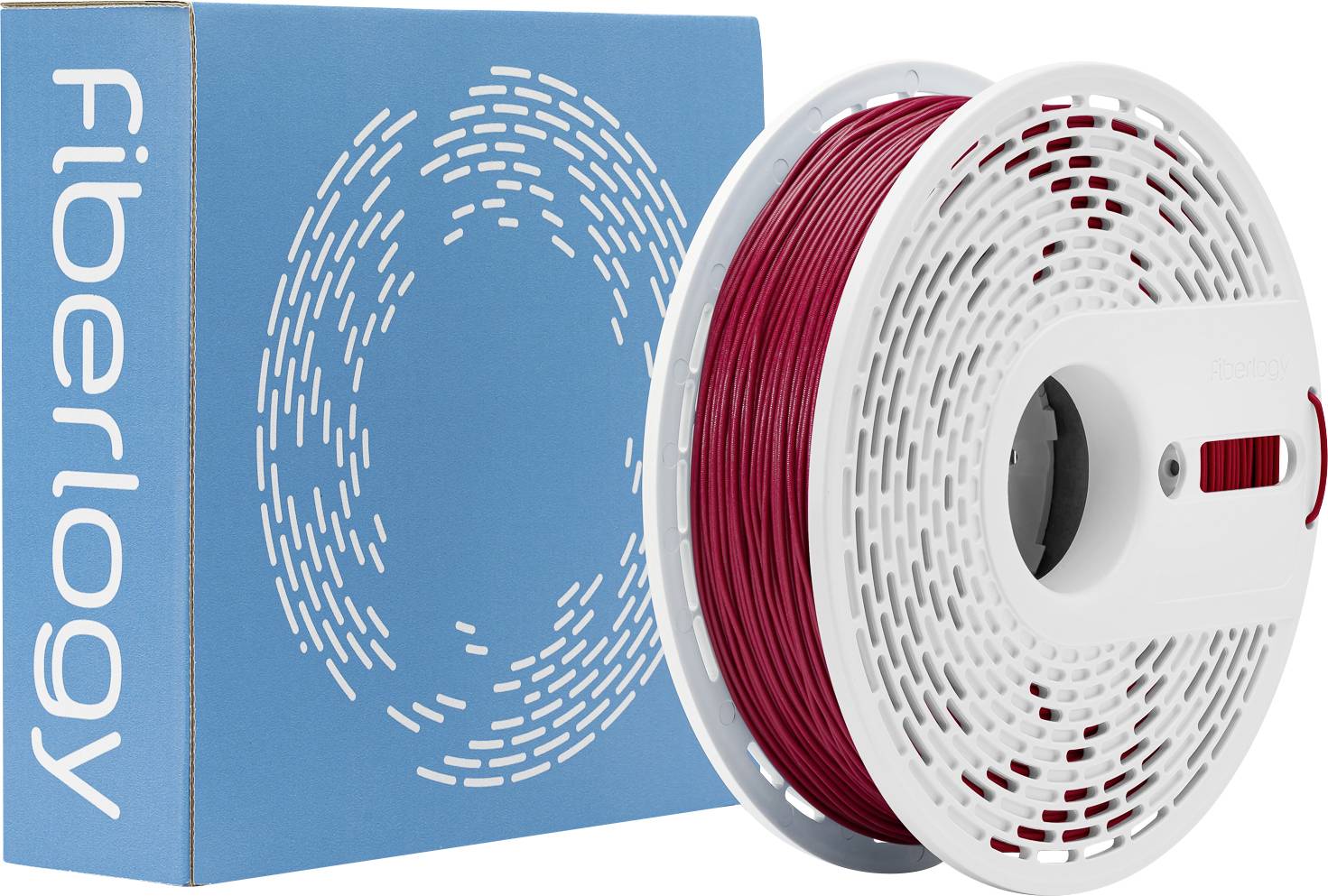 Bobine de filament 3D rouge à côté d'un boîte bleue étiquetée « Fiberlogy ».