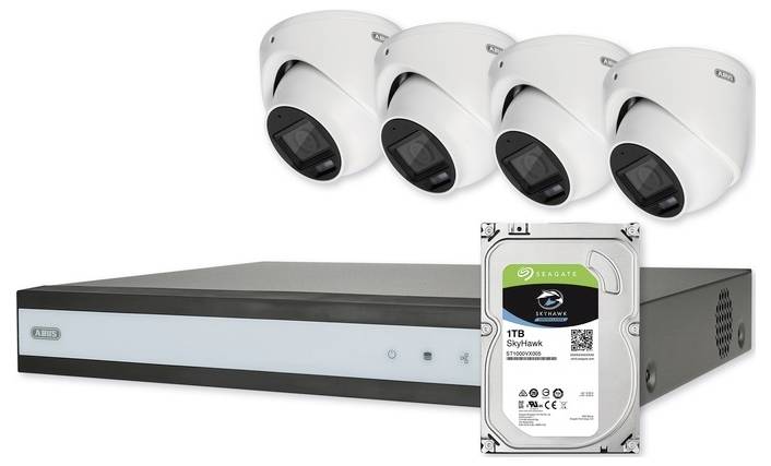 Système de caméras de sécurité comprenant quatre caméras dômes, un enregistreur vidéo réseau et un disque dur Seagate Skyhawk de 1 To pour la surveillance.