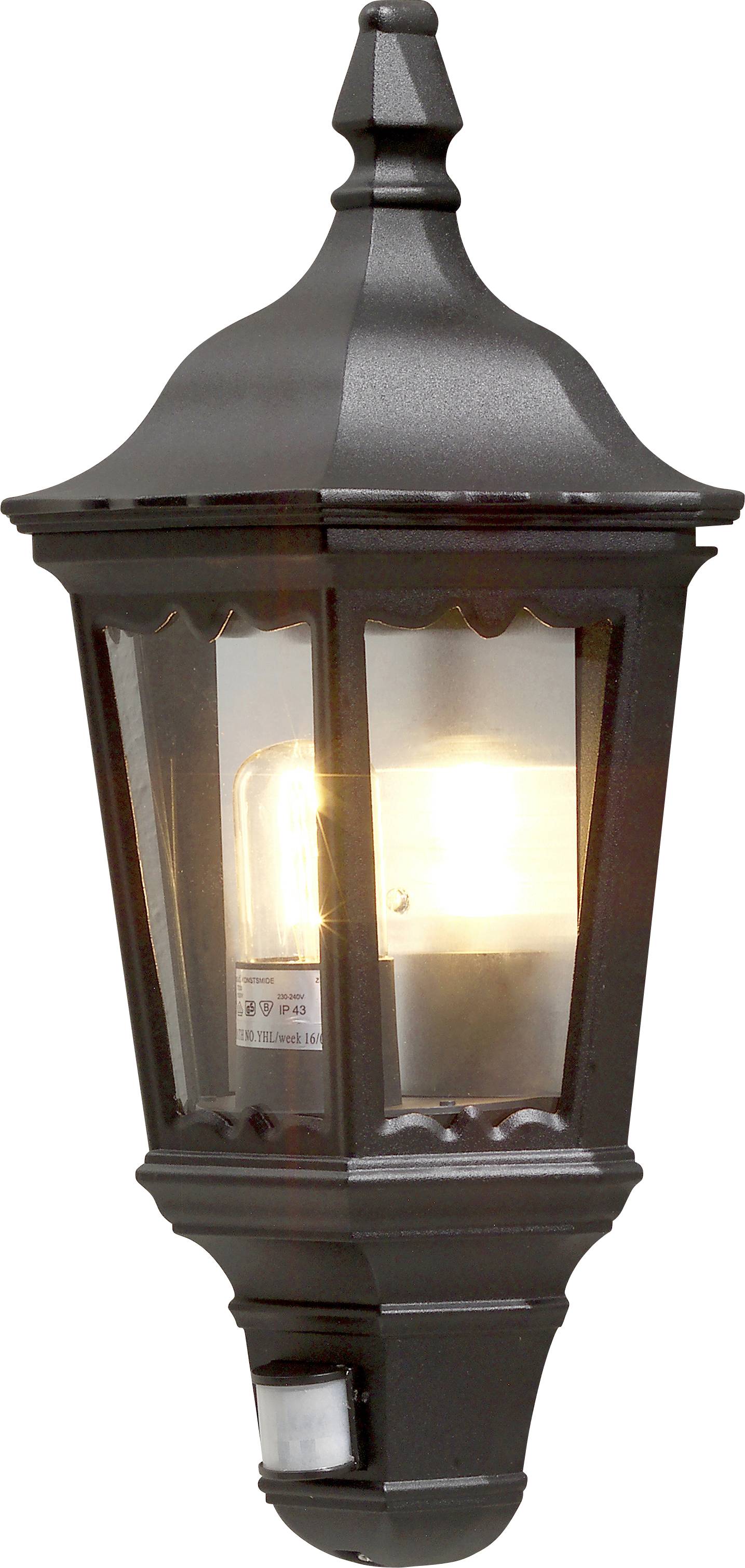 Lanterne murale extérieure noire ornementée avec ampoule lumineuse, présentant un design classique adapté à la décoration extérieure d'une maison.