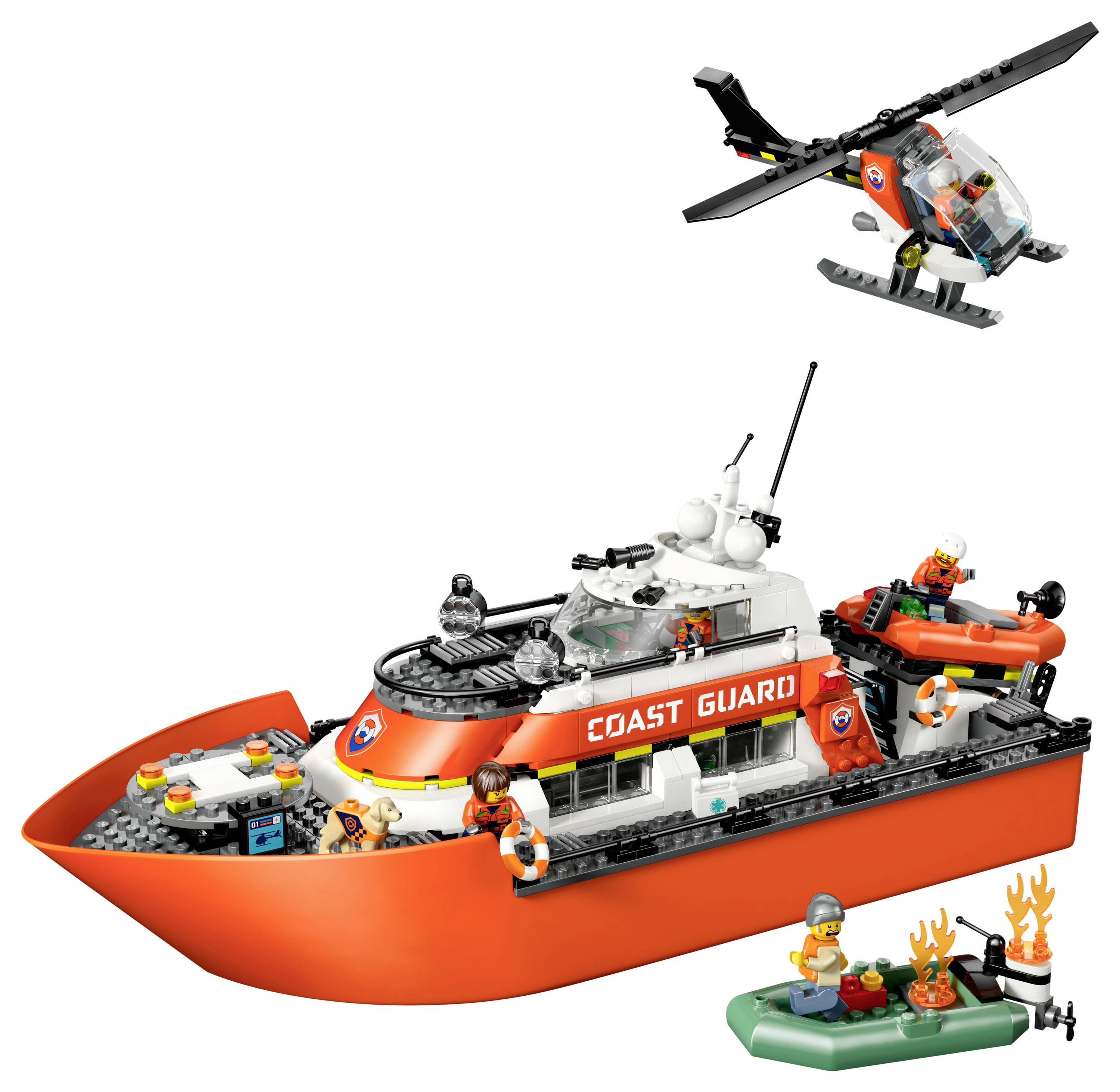 Ensemble LEGO de la Garde côtière comprenant un grand bateau, un hélicoptère, un radeau pneumatique et des figurines impliquées dans une mission de sauvetage.