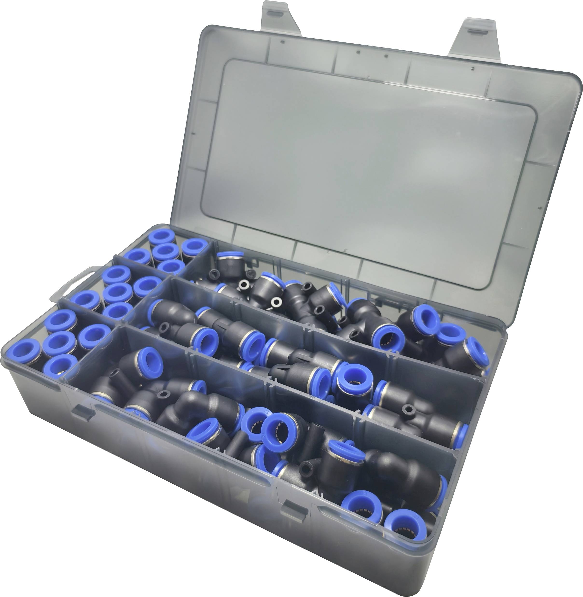 Une boîte en plastique ouverte contenant des raccords de tuyaux en plastique noir et bleu assortis, organisés dans des compartiments pour la plomberie ou les réparations.