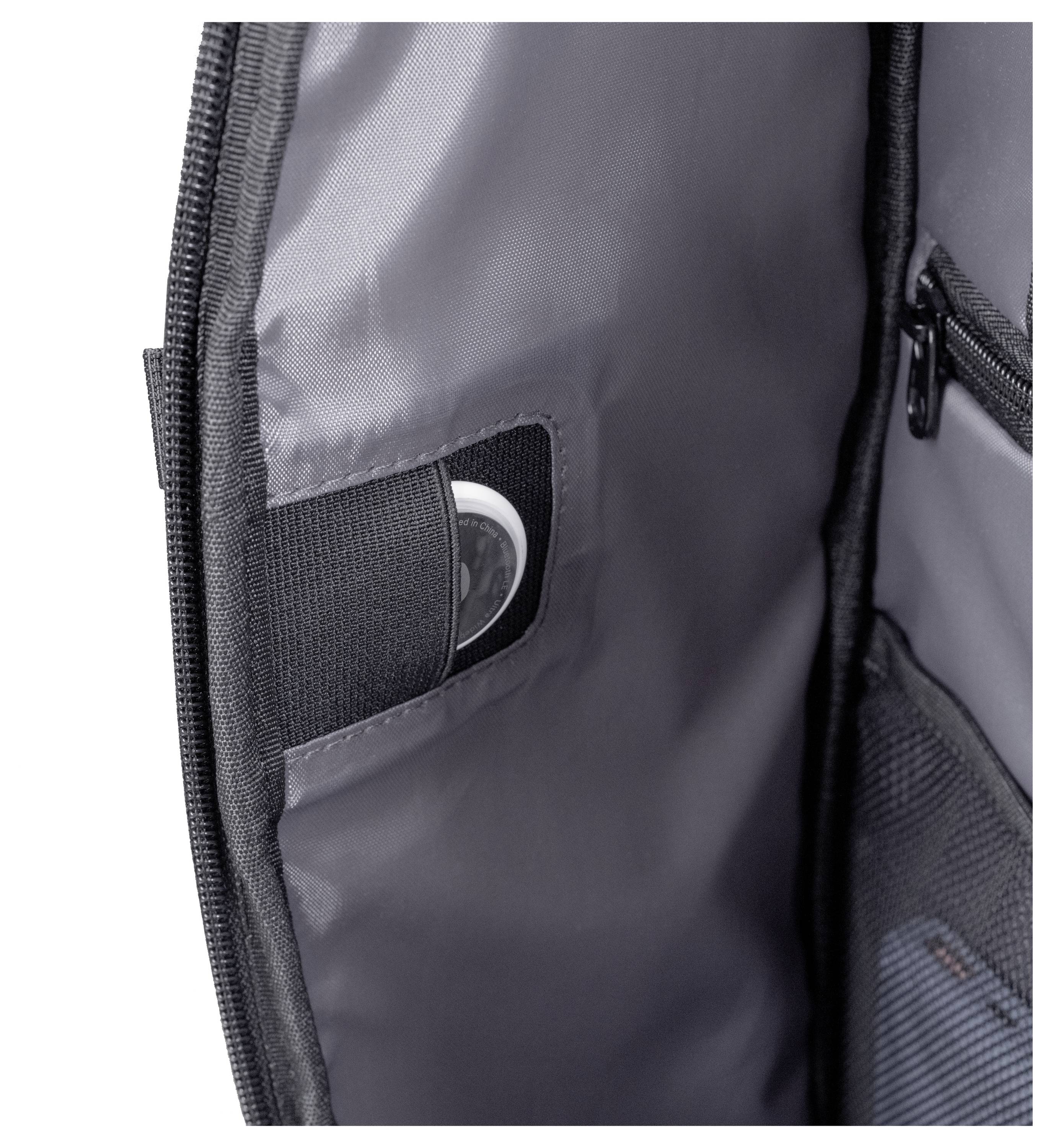 Intérieur ouvert d'un sac montrant une poche avec un appareil électronique circulaire partiellement visible, mettant l'accent sur la fonctionnalité de rangement de la poche.