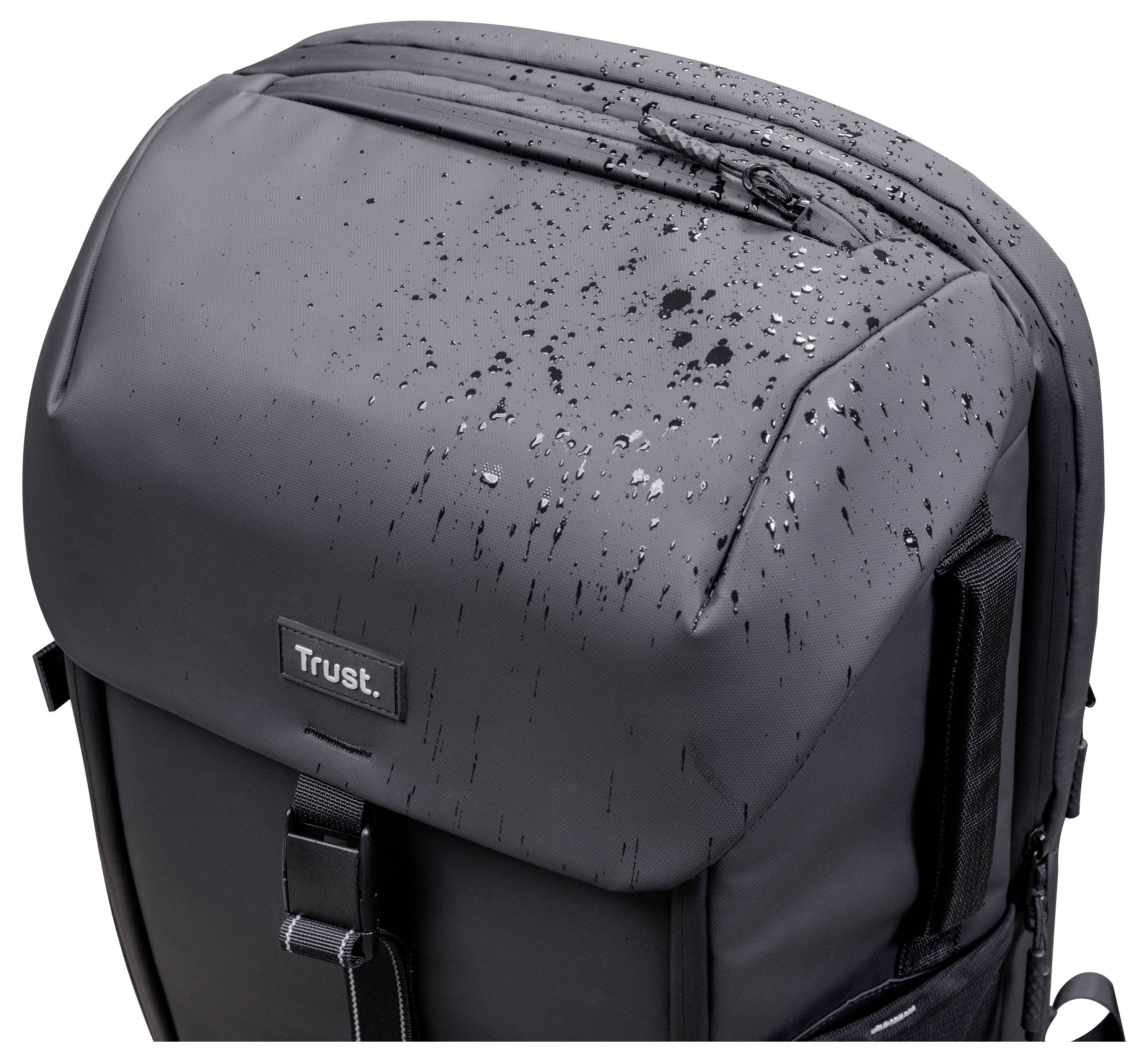 Un sac à dos noir avec un logo 'Trust' sur le devant, présenté avec des gouttelettes d'eau sur sa surface, indiquant qu'il est résistant à l'eau.