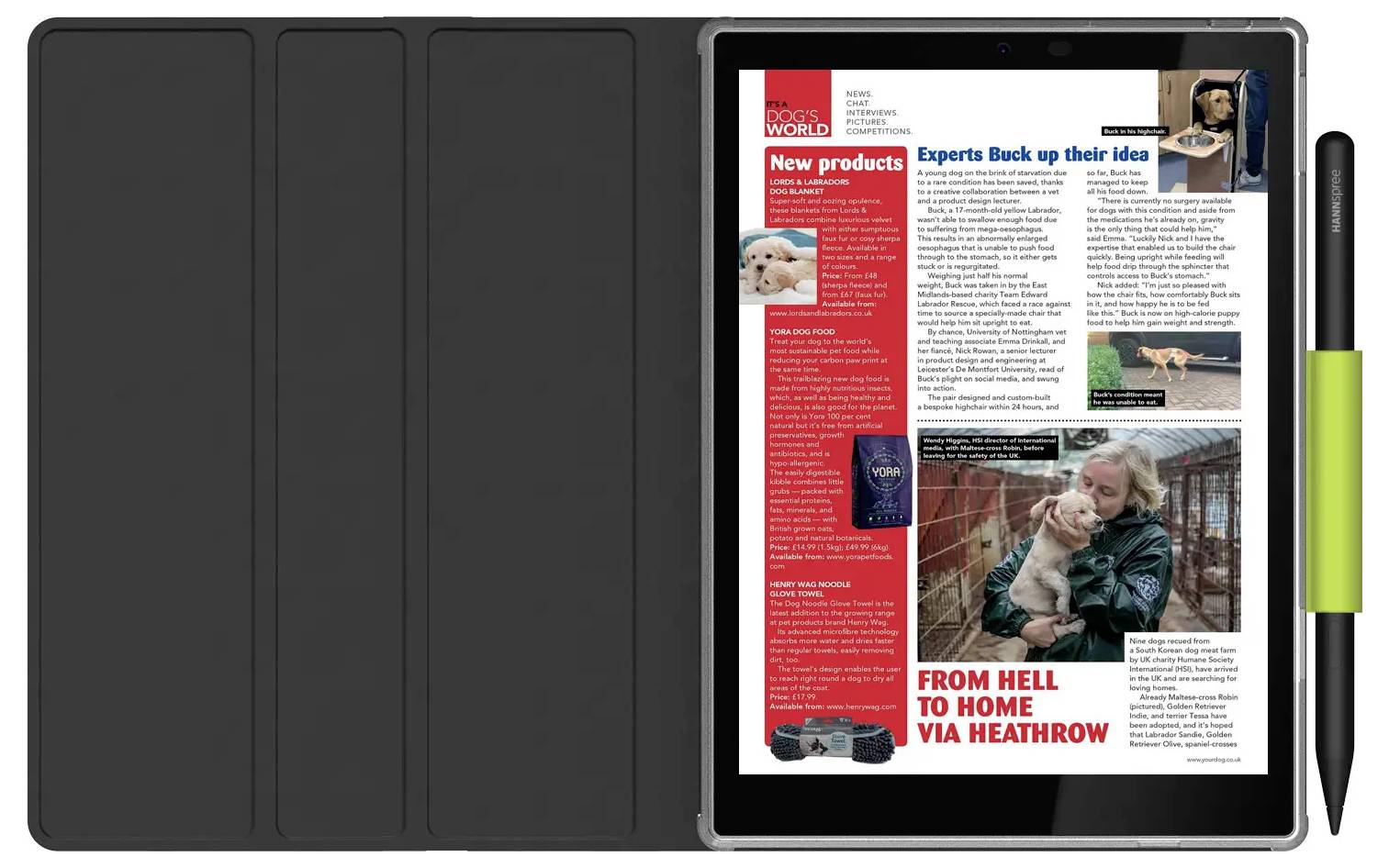 Magazine «Monde des Chiens» affiché sur une tablette avec des articles sur de nouveaux produits pour chiens et des histoires de réadoption, à côté d'une image d'une femme tenant un chien.