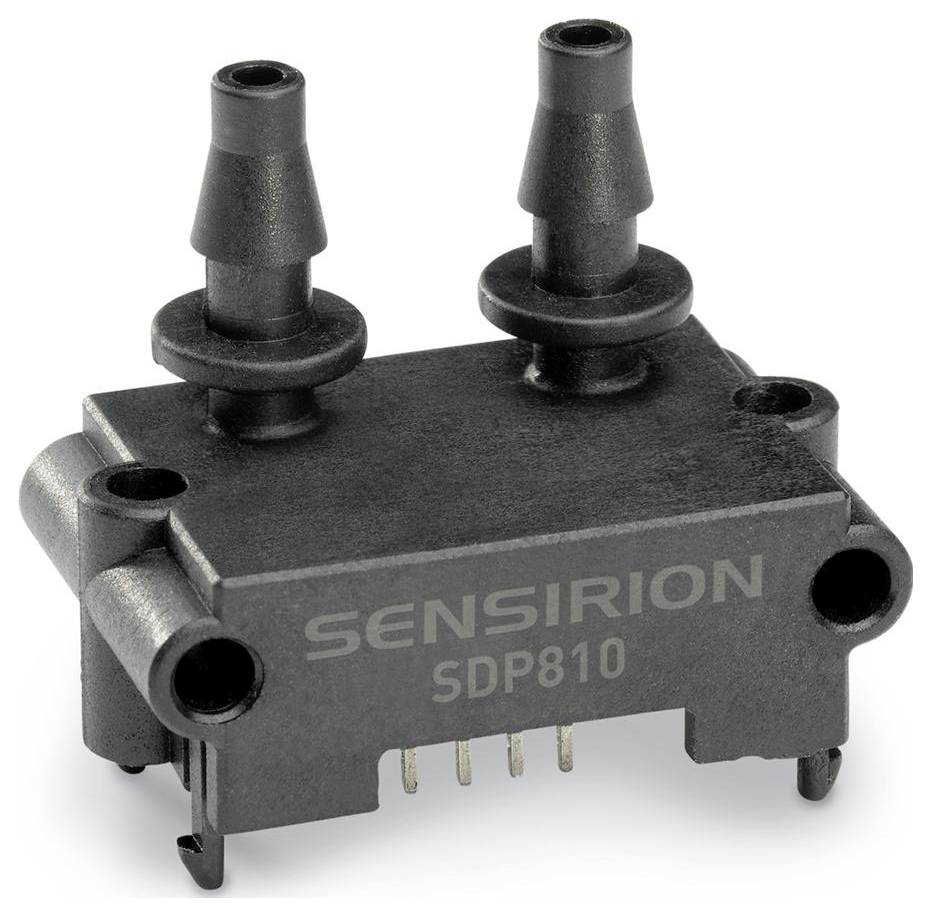 L'image montre un capteur de pression différentielle Sensirion SDP810 avec deux connexions de buse en haut et des broches électriques en bas.