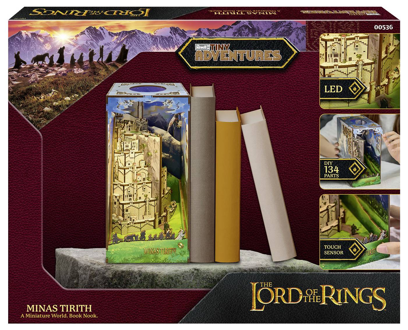 L'image présente un livre-diorama miniature de la 'Minas Tirith' de la série 'Le Seigneur des Anneaux', avec des détails de château complexes, un éclairage LED et 134 pièces.