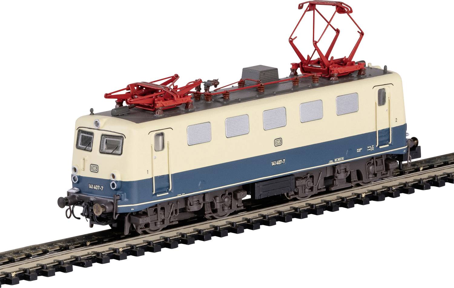 Train électrique miniature en beige et bleu avec des pantographes rouges sur voie normale.