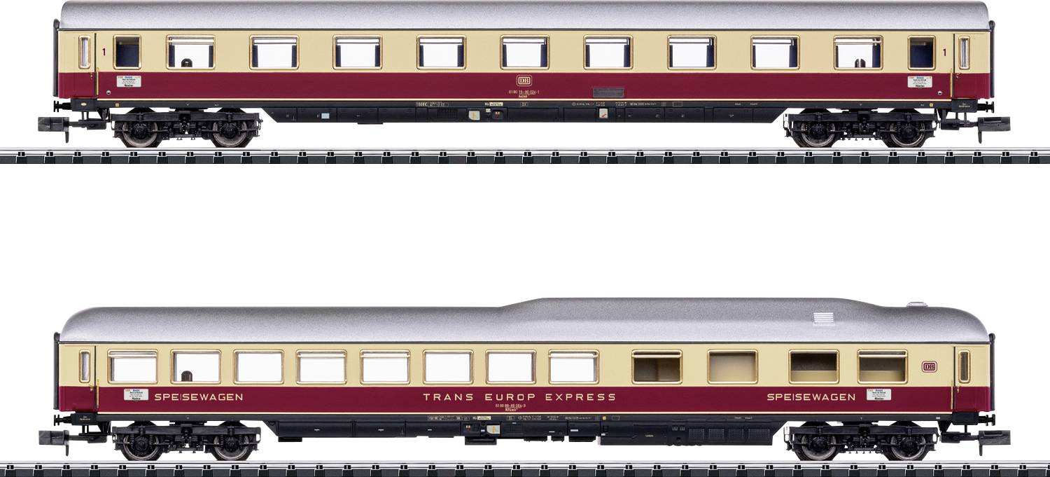 Voitures de train miniatures sur des rails, conçues pour ressembler aux wagons classiques de passagers du Trans Europ Express avec des détails extérieurs détaillés.