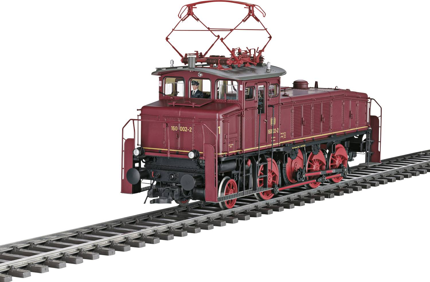 Un modèle de train électrique vintage rouge sur un rail, présentant six grandes roues et une structure distinctive de collecte de courant aérienne.